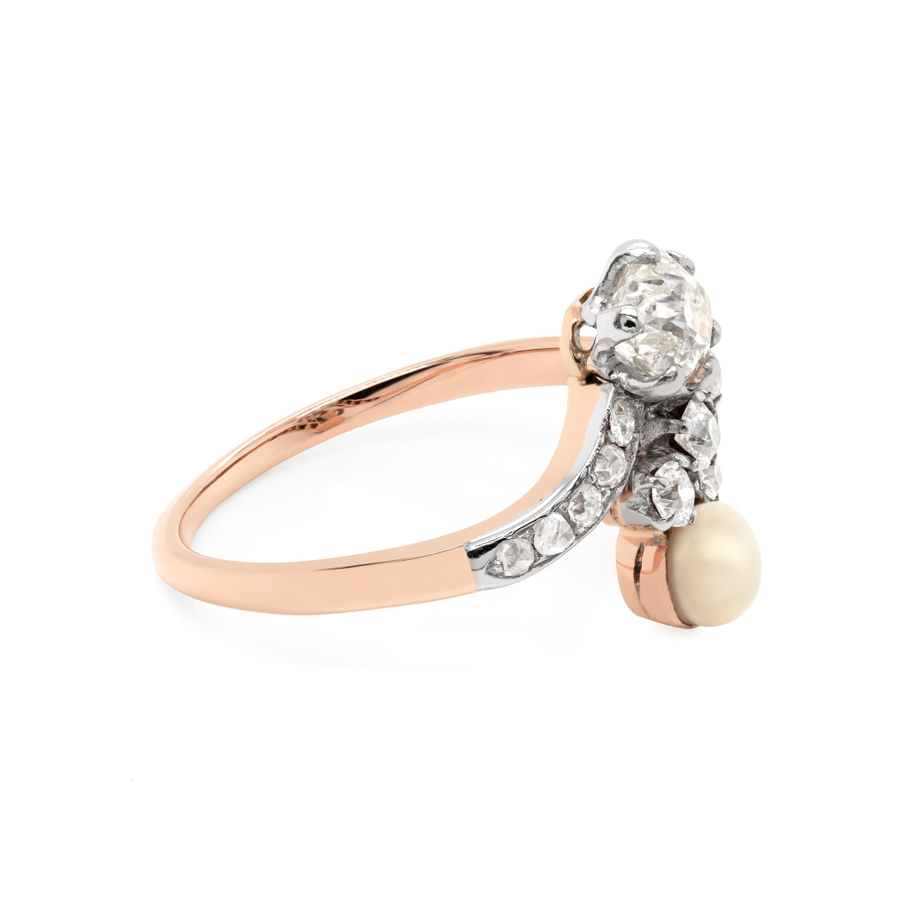 This incredible Edwardian crossover engagement ring features a 0.67ct old mine cut diamond set in a six claw open back setting complimented by a natural saltwater pearl measuring 3.85 × 4.45mm.
Both pearl and diamond are each preceded by five old