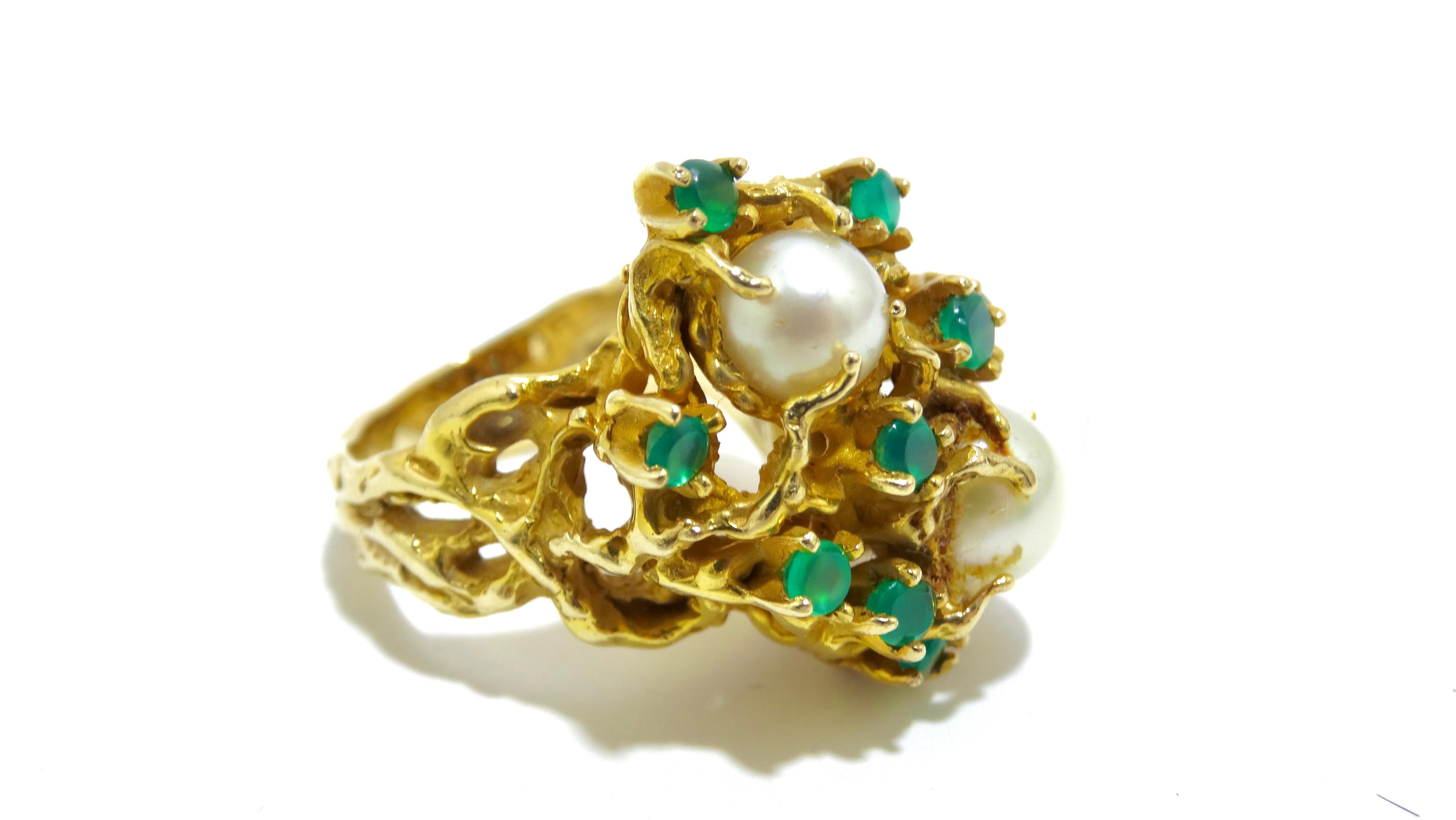 This 70's cocktail ring is the center of attention when you accessorize the right way. This ring has an intricate woven-look gold detailing, 10 emerald stones, and two large pearls. Pair it with a classic little black dress from Gucci. 

Length: