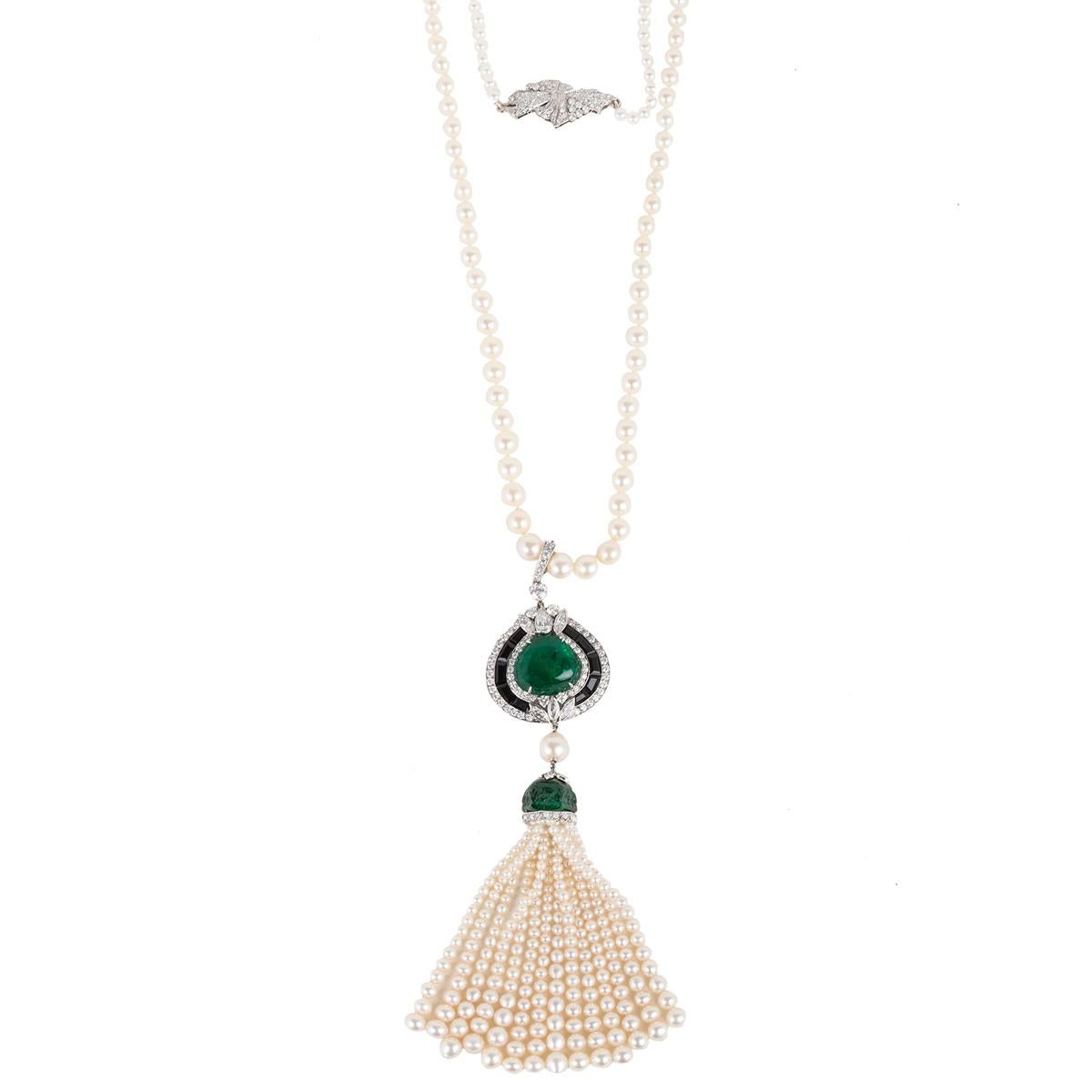a long graduated chain with freshwater pearl
20 carat Heart-Shaped Cab Emerald Pendant
Graduated Tassel with carved Emerald umbrella
Platinum Clasp with diamonds
