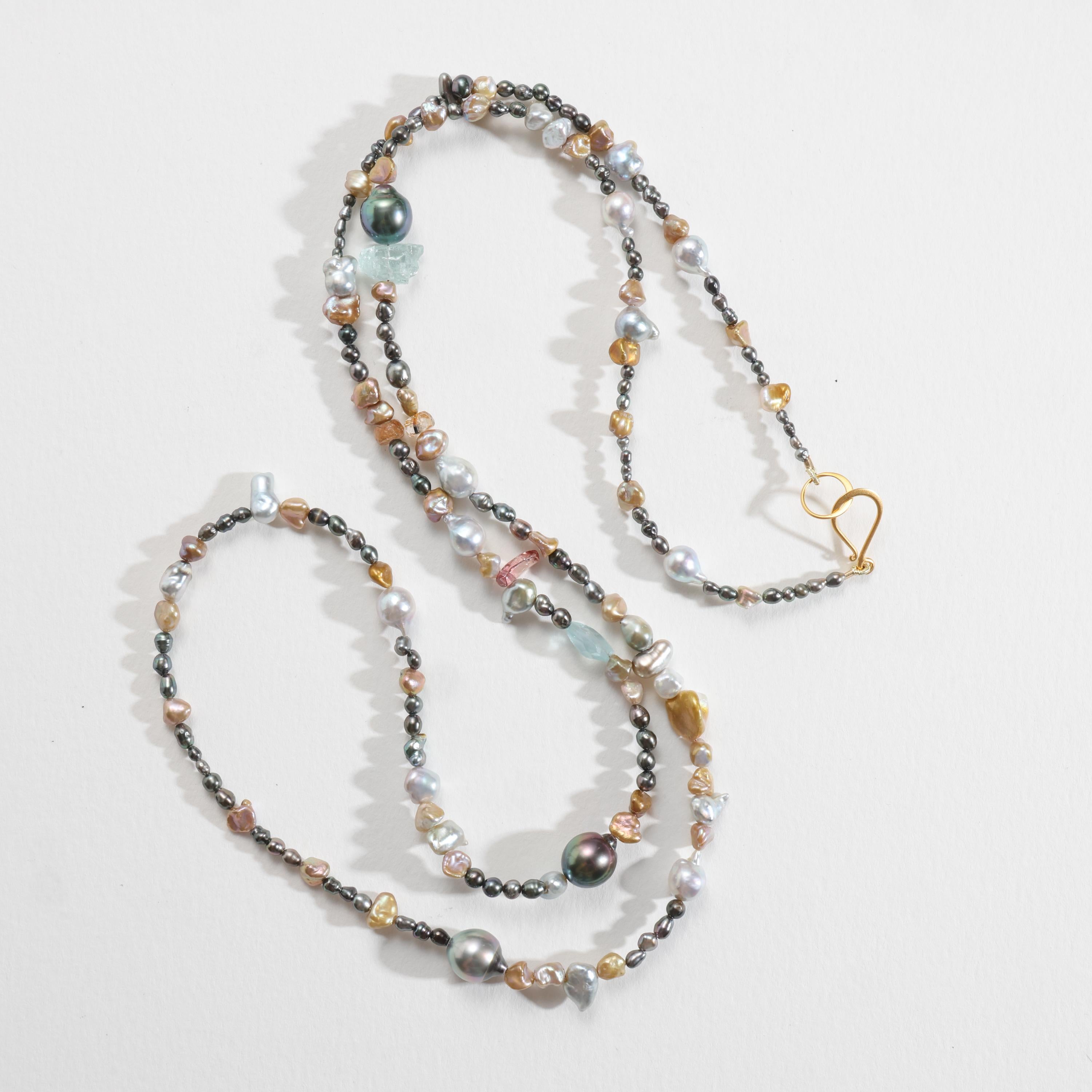 Naturally-colored South Sea Keshi, baroque Tahitian, luminous Akoya, and Chinese freshwater pearls are strung together with glassy aquamarine and tourmaline crystals to create a luxuriously long -36