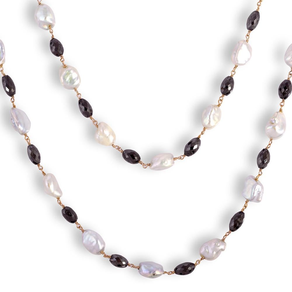 Pretty Fresh water pearl and Black Faceted Ice Diamond necklace knotted in 18K rose gold wire is 42 inch long and sleek. This necklace doesn't  have any clasps so has to be worn over the head.. and can be layered.

18kt: 2.66g
Diamond: