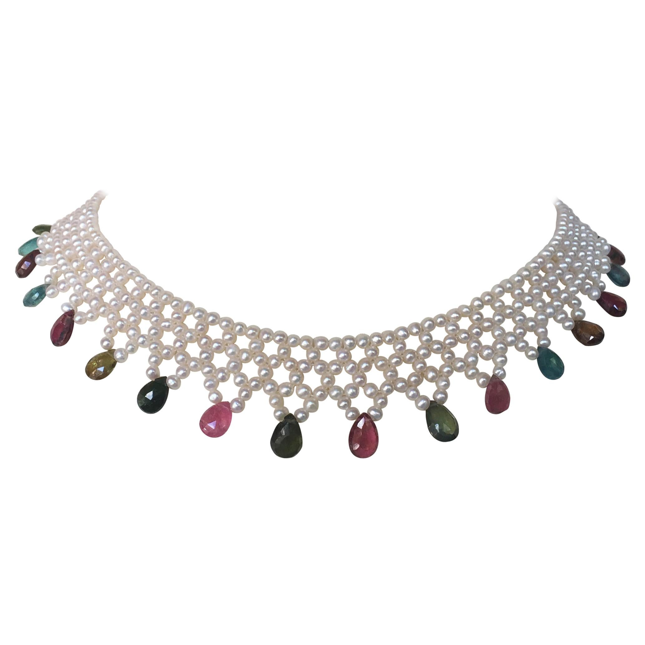 The white pearls and multi color tourmaline briolettes are woven into an elegant necklace with a vintage 14k yellow gold clasp. The small round white pearls are woven into a lace like design, finished with beautiful warm toned multi-color tourmaline