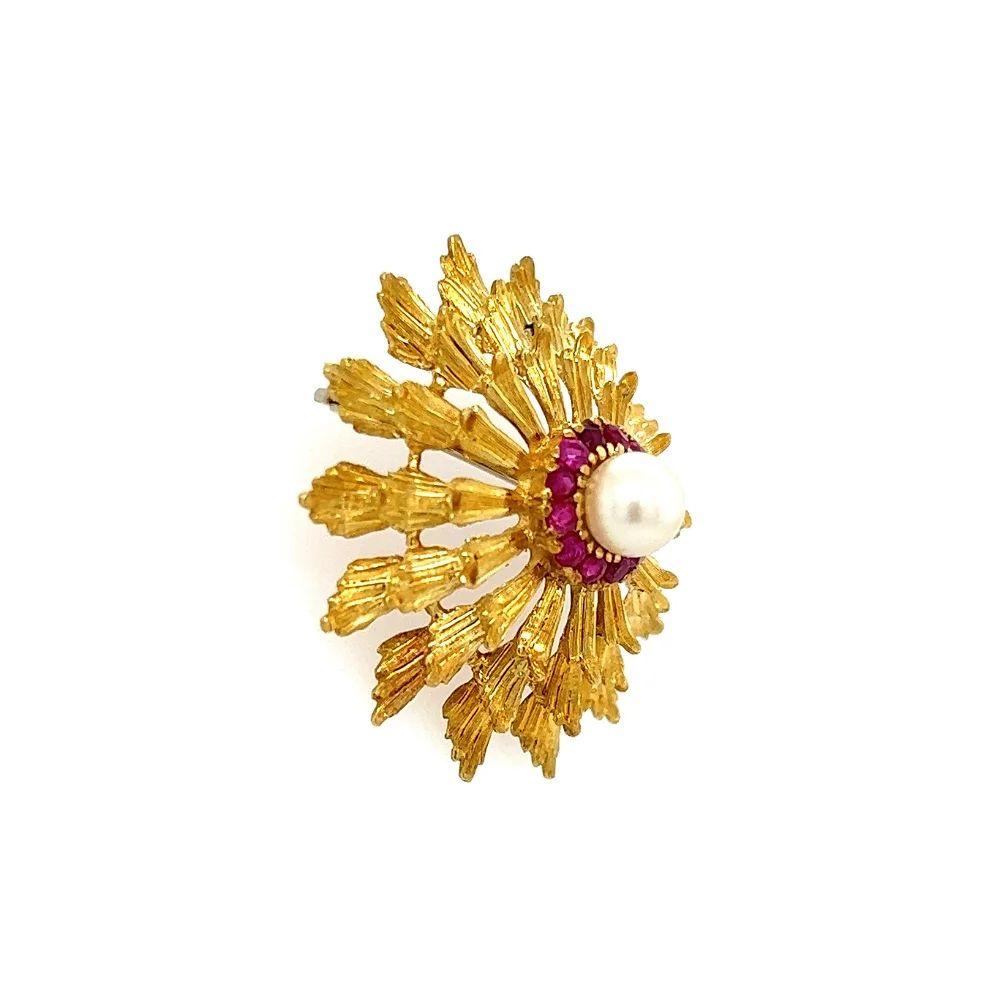 Simply Beautiful! Pearl and Ruby Brooch Pin. Hand crafted in 18K Yellow Gold, centering a 6.2mm Pearl surrounded by Hand set Rubies weighing approx. 0.30tcw. Approx. Dimensions 1.35” l x 1.35”. in excellent condition, recently professionally cleaned