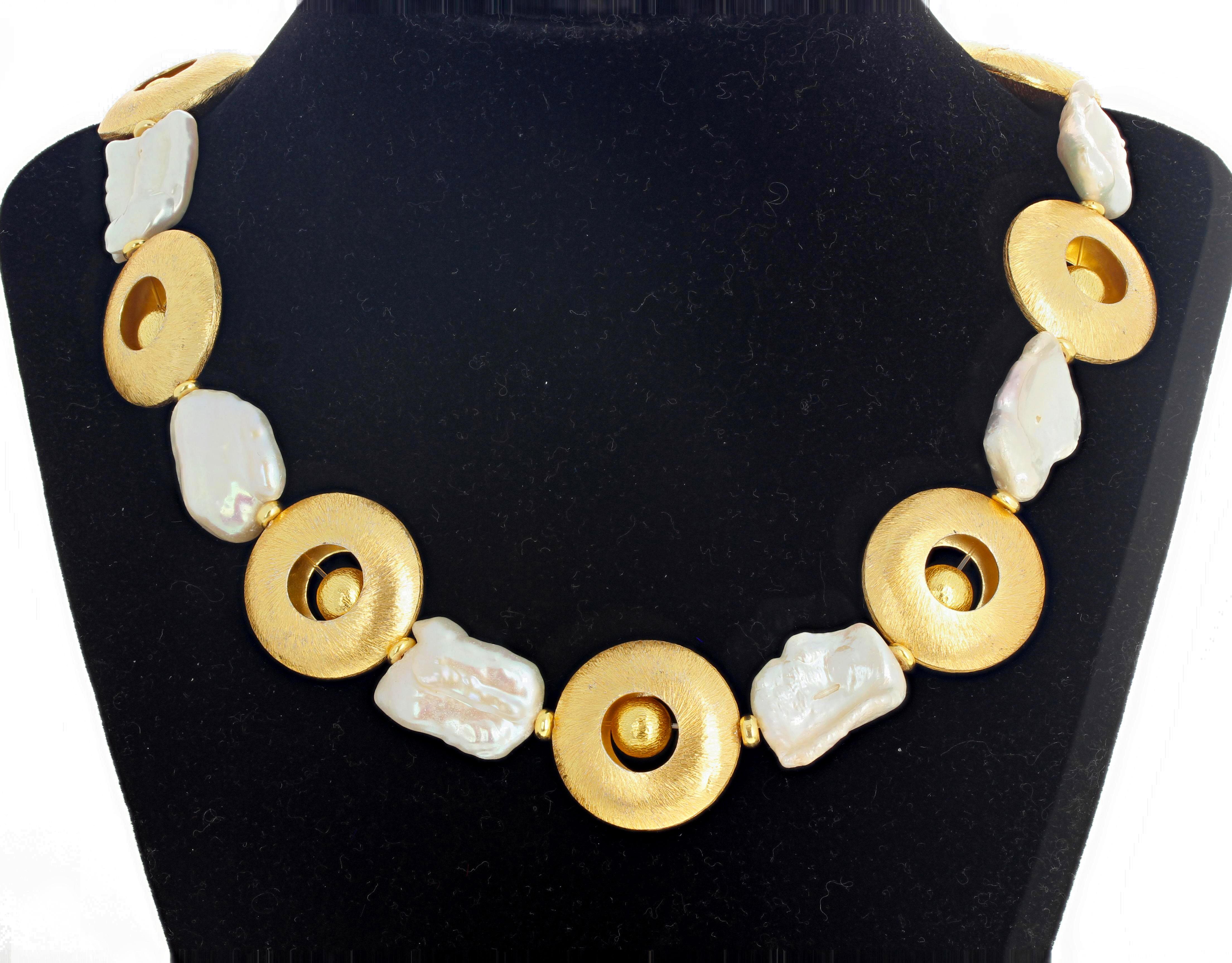 Beautiful vermeil (gold plated sterling silver) rings with flippy gold plated sterling silver balls enhanced by gorgeous white cultured pearls combine to make this necklace unusually beautiful and glamorous.  The Vermeil rings are 25 mm across and