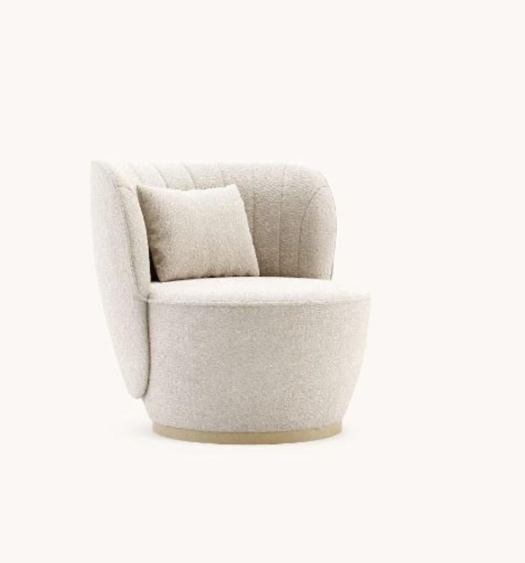 Pearl armchair by Domkapa
Materials: Natural Ash, Bouclé. 
Dimensions: W 88 x D 82 x H 78 cm. 
Also available in different materials. Please contact us.

Pearl armchair holds an exclusive language for its peculiar design. With a deep convex