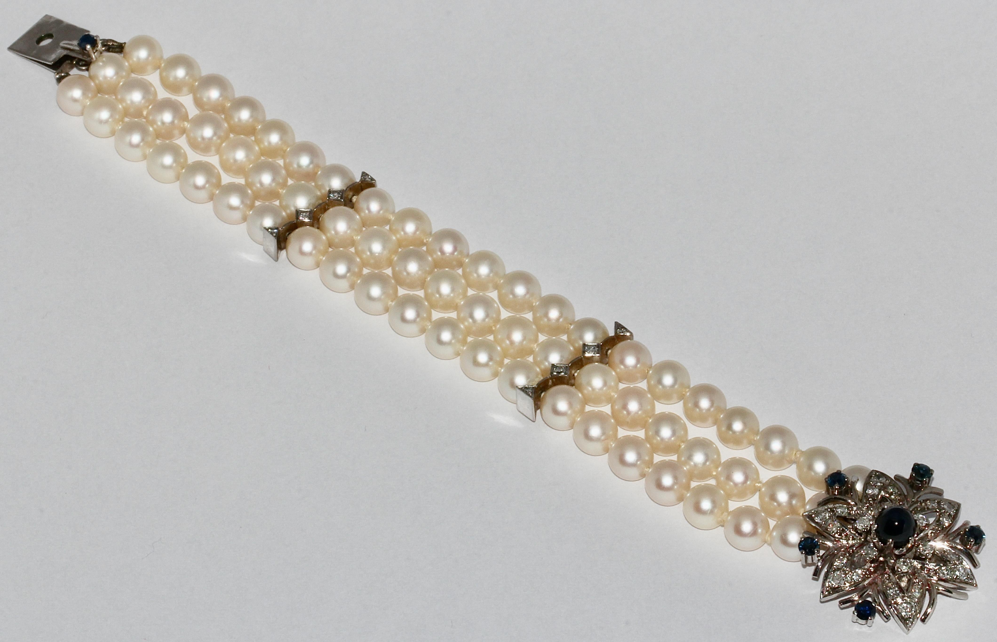 Three-row pearl bracelet with large white gold clasp. Set with sapphires and diamonds.

Including certificate of authenticity.