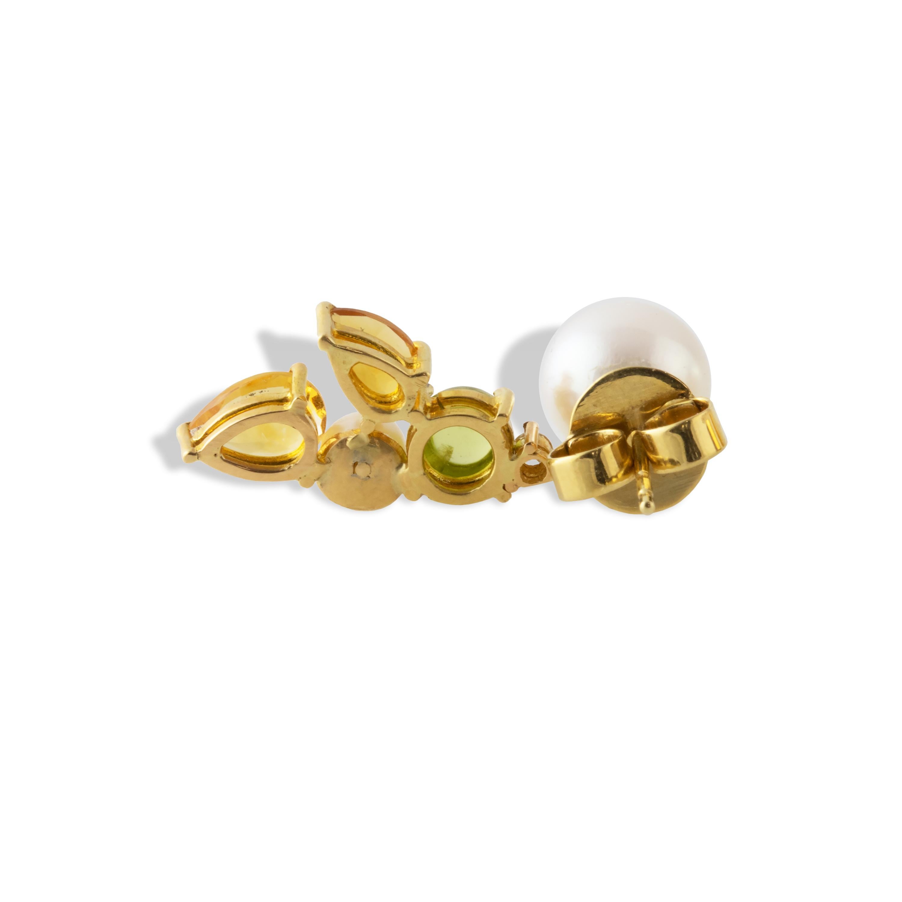 These 'Limoncello' asymmetrical earrings are named after the colors of the Amalfi Coastline and feature Akoya pearls, Citrine, Peridot and a diamond.  One one side sits an 8.5mm pearl with a golden tip, while the other side features an 8.5mm and