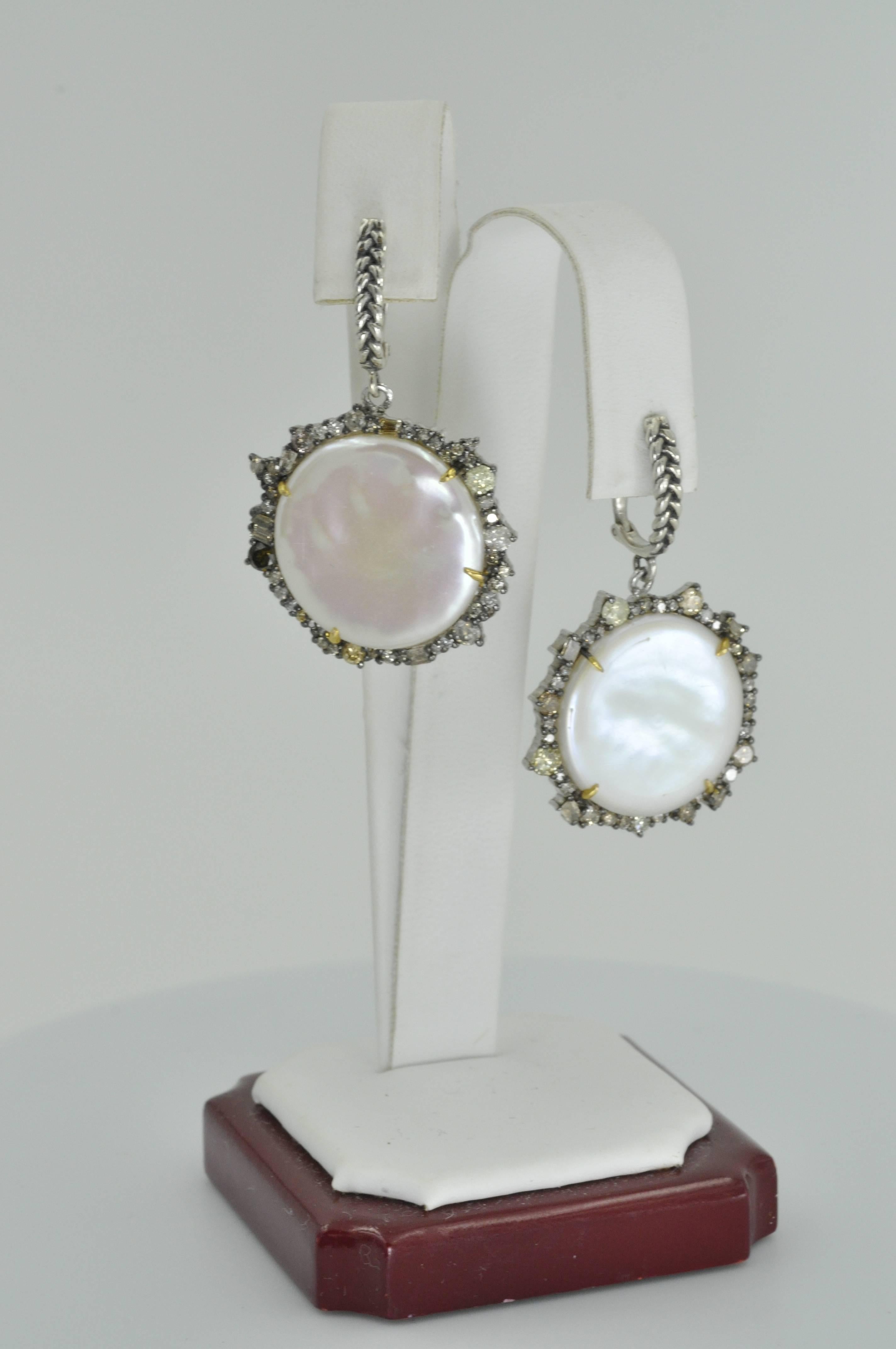 Pearl Coin and Diamond Earrings designed by renowned American designer Vincent Peach. One of a kind Coin Shape Freshwater Pearl earrings set in Sterling Silver with 14 Karat Gold Posts & Prongs 3.39 carats of Champagne and Yellow Colored Diamonds.
