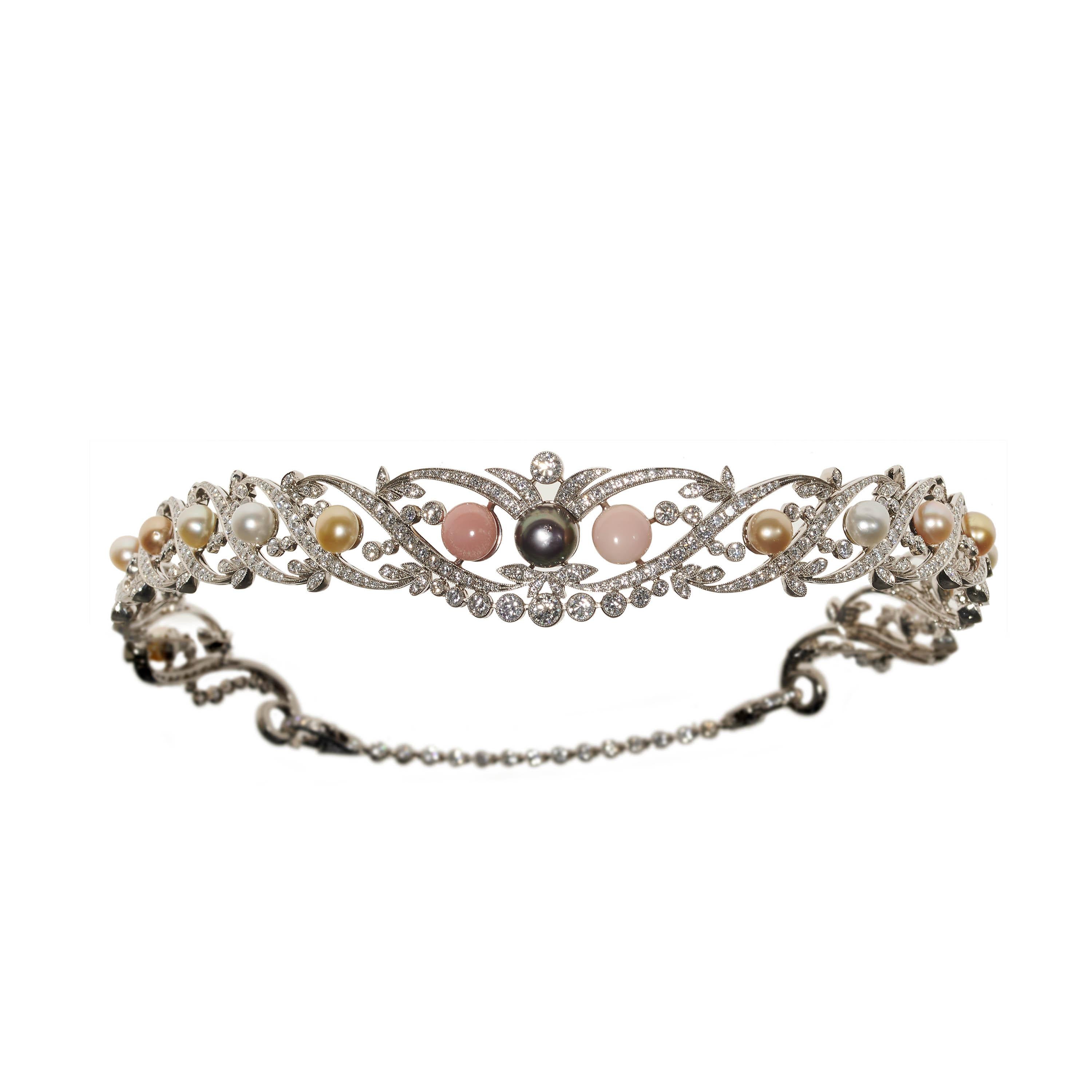 A modern pearl and diamond tiara, the openwork design featuring cultured pearls of varying colours, the black pearl weighing an estimated 5.42 carats, the conch pearls weighing an estimated total of 7.24 carats, and the remaining pearls weighing an