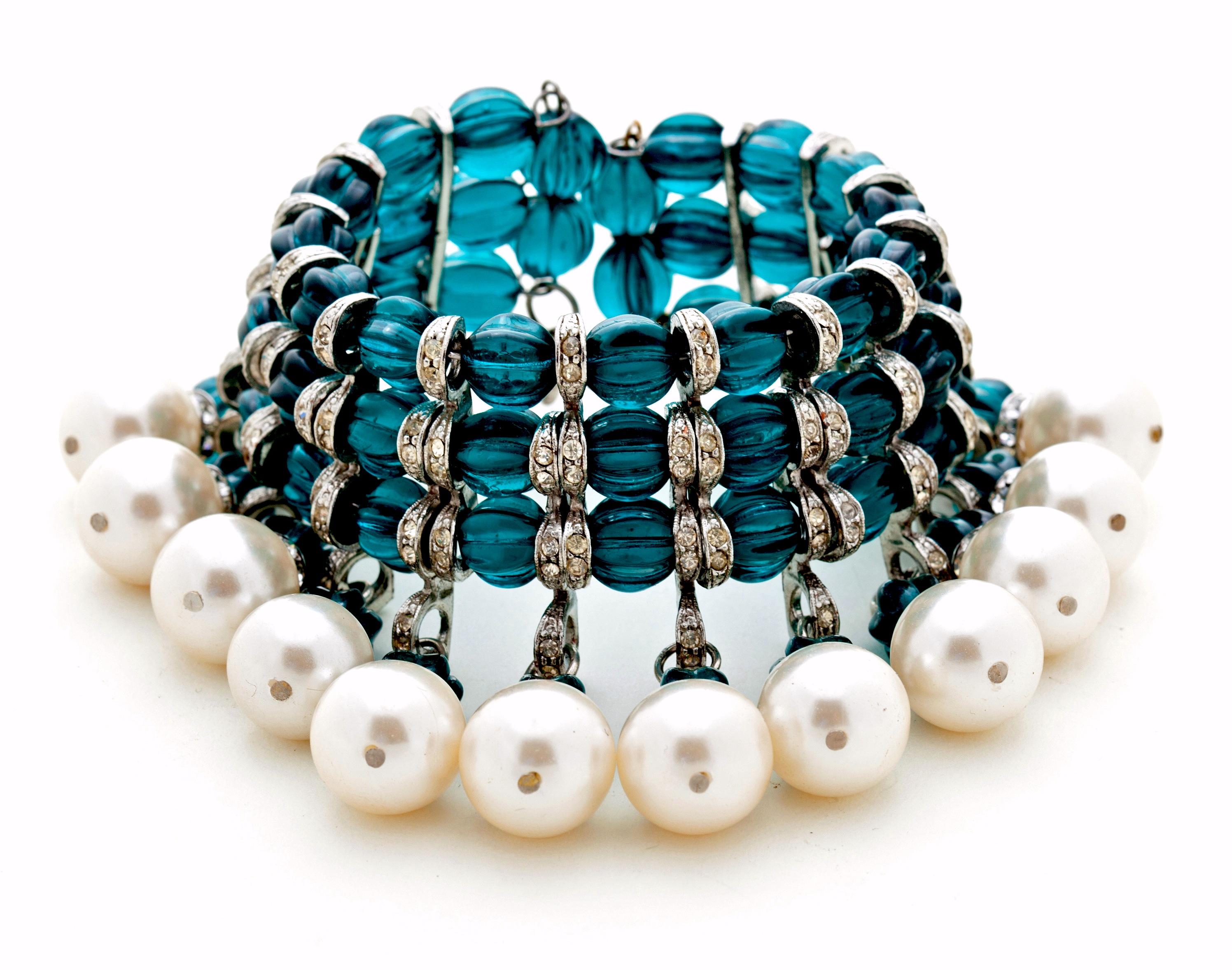 Stunning runway bracelet with great movement and fantastic green teal glass beads, chunky faux pearls and crystals.  This super chic bracelet can fit a variety of wrists since it wraps and can fit a small or larger wrist.  Great jingle jangle and