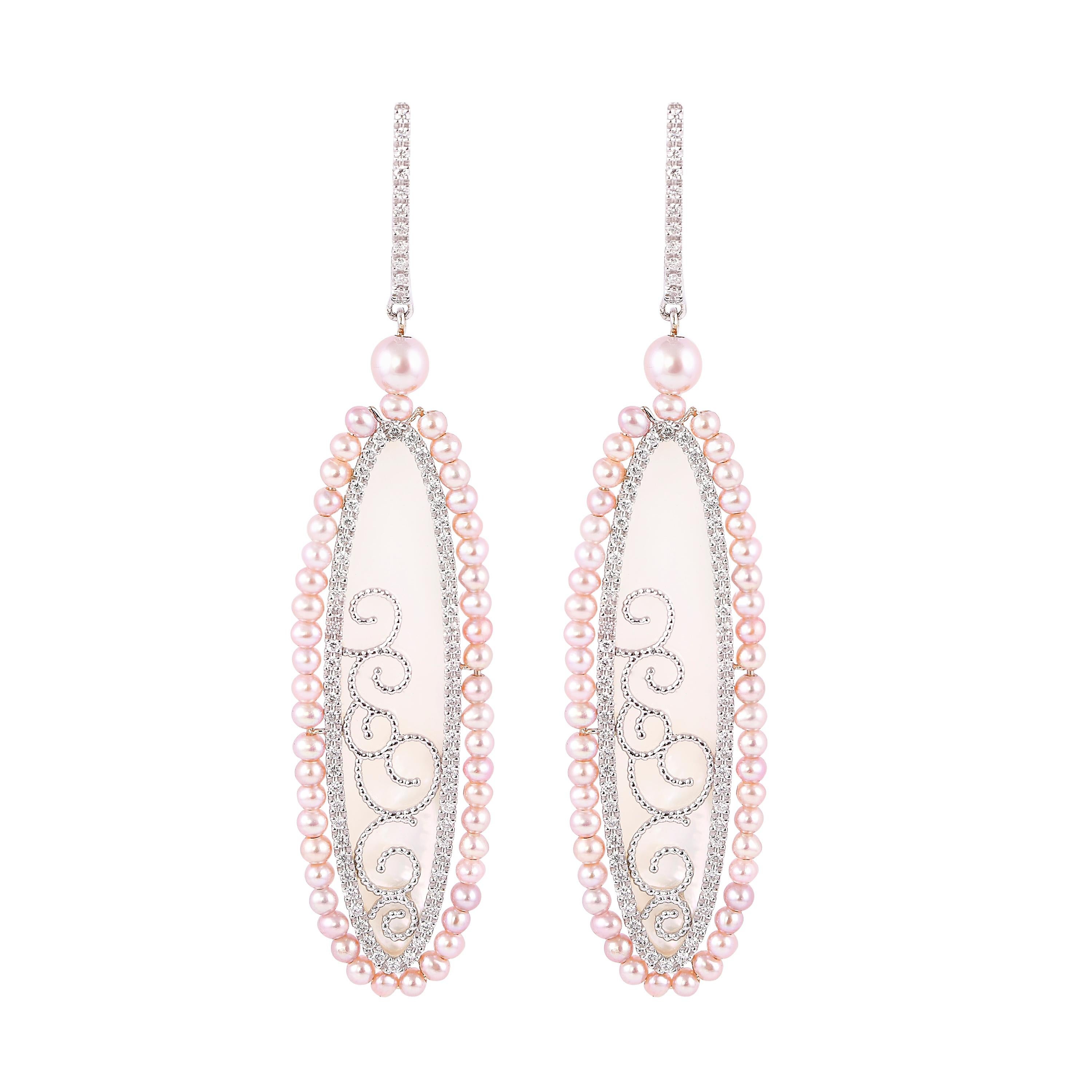 An exclusive collection of designer and unique dangle earrings by Sunita Nahata Fine Design. 

Pearl Dangle Earring in 18 Karat White Gold.

Mother of Pearl: 7.68 carat, Fancy Shape, G colour, VS clarity.
Pink Pearl: 6.22 carat, 2.00 Size, Ball