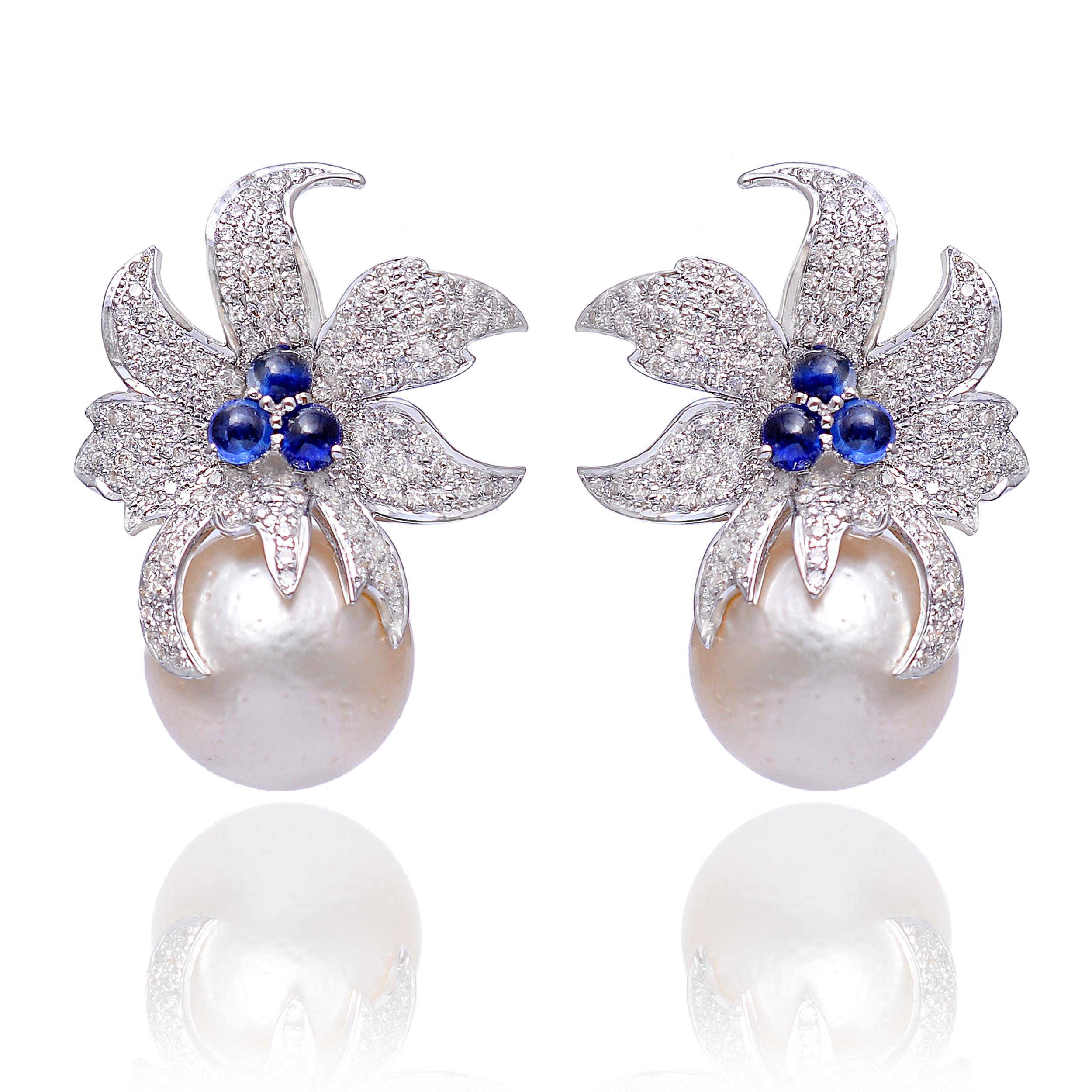 Get ready to spellbind in these exceptionally beautiful dangle earrings. Expertly crafted with sapphire, emerald pearl and diamonds, this timeless design is set in 14K white gold. 

Specifications:

Dimensions: 25 x 15 MM
Gross Weight: 13.610
