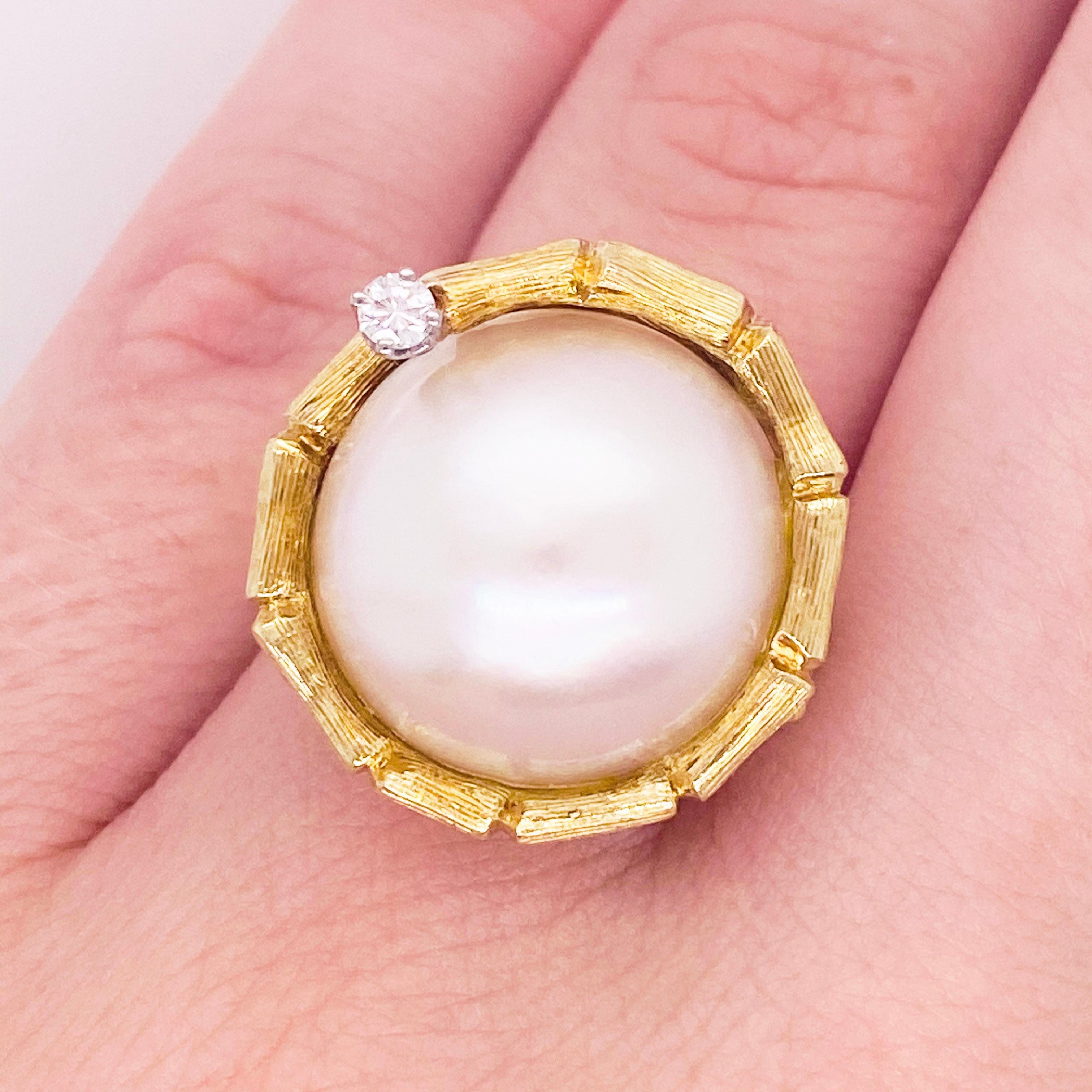This luxurious ring would make the perfect gift for your loved one or yourself! This large pearl delicately encircled in 18 karat gold and accented with a round white diamond is quite a stunner. It's very classy and elegant while also acting as a