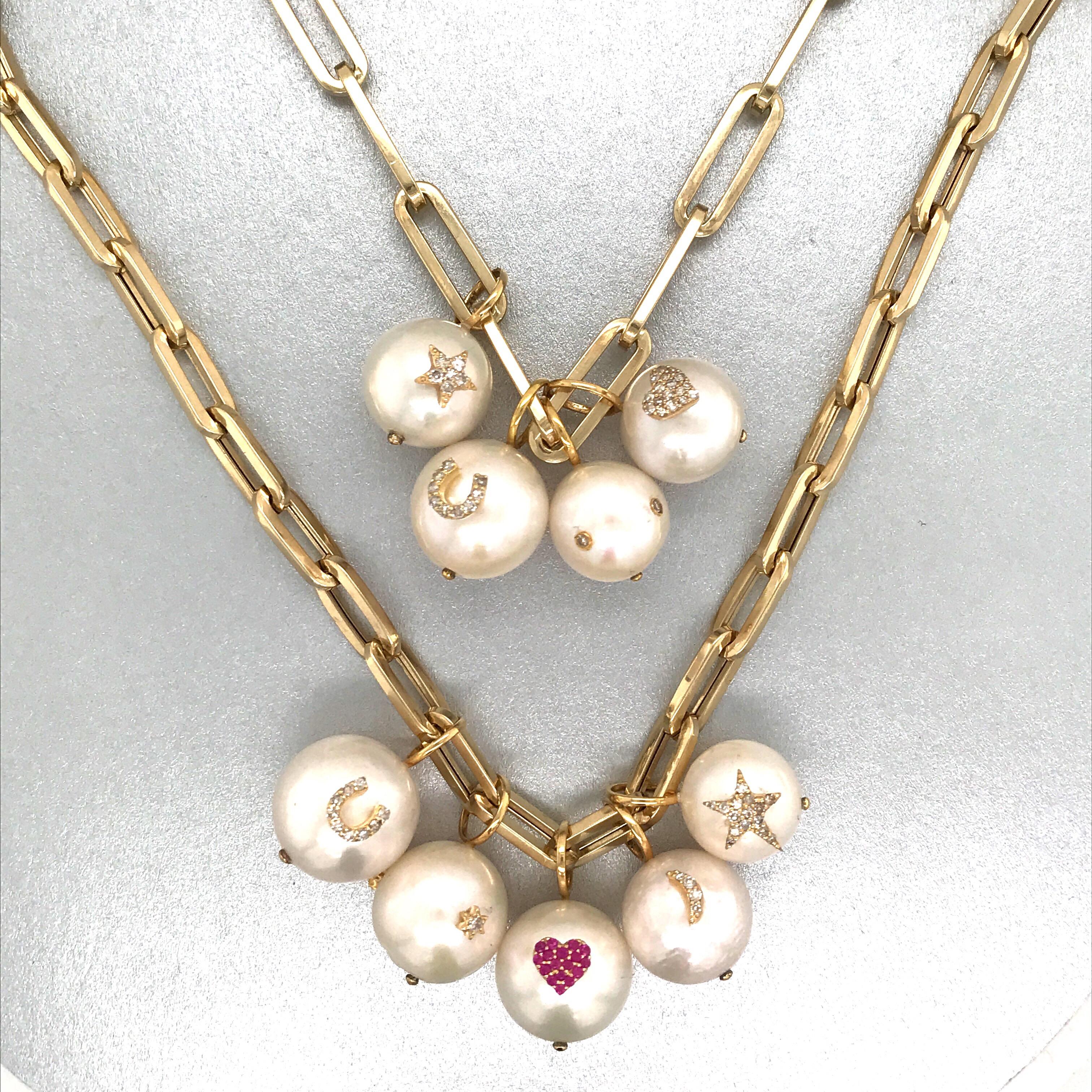 14K Yellow gold link necklace featuring pearl charms of stars, moons, hearts, horse shoe, and diamonds.
Charms can be purchased individually. Email for specific pricing. 
Do not have to purchase necklace, only charms. 

Customize your own stack!