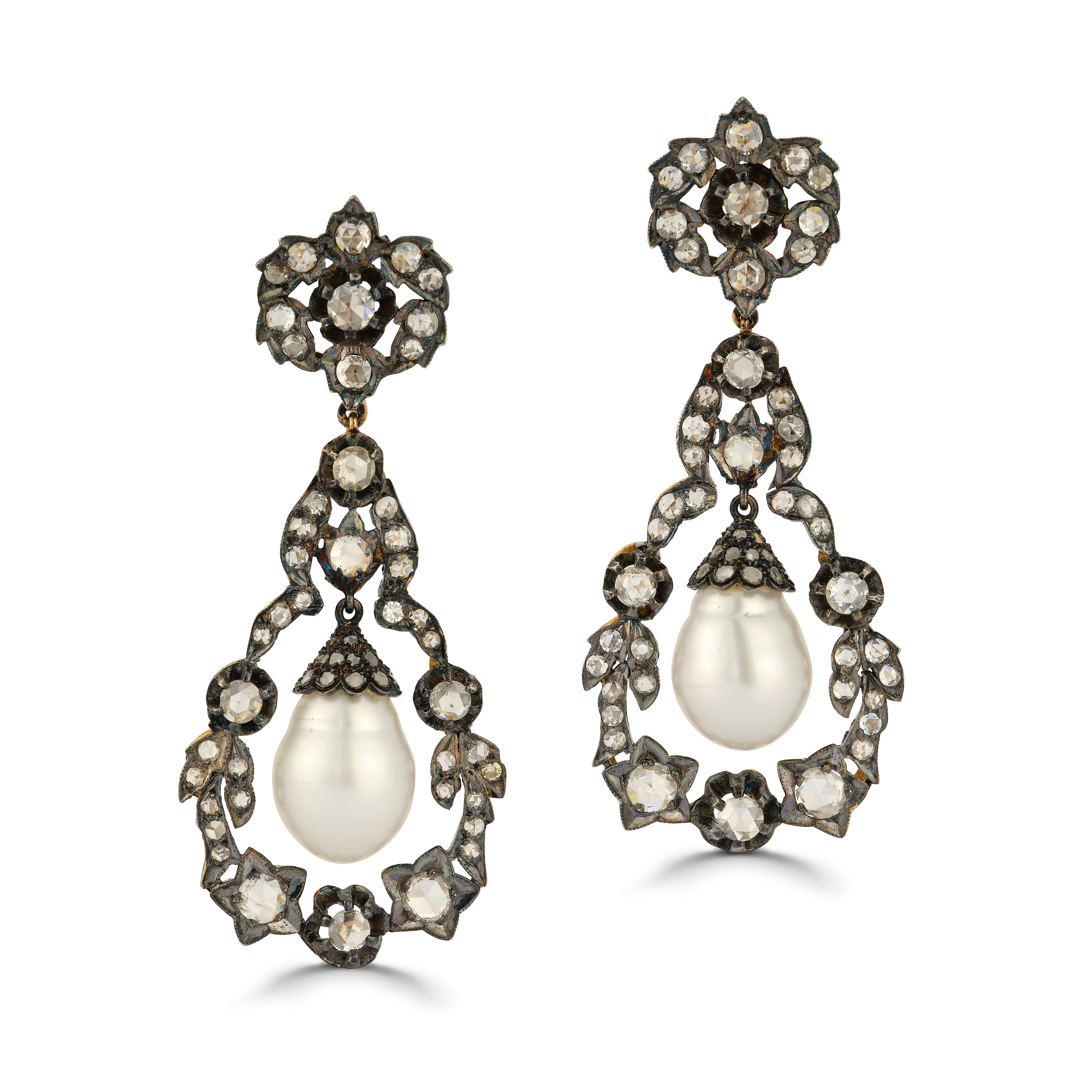 Pearl & Diamond Earrings

Diamond total approximate weight: 7.0ct

Yellow gold and silver clip on with post earrings each set with a pearl diamonds

Diamond total approximate weight: 7.0ct

Pearls Measurements: 16.8mm x 12mm & 17.5mm x 12mm

Metal