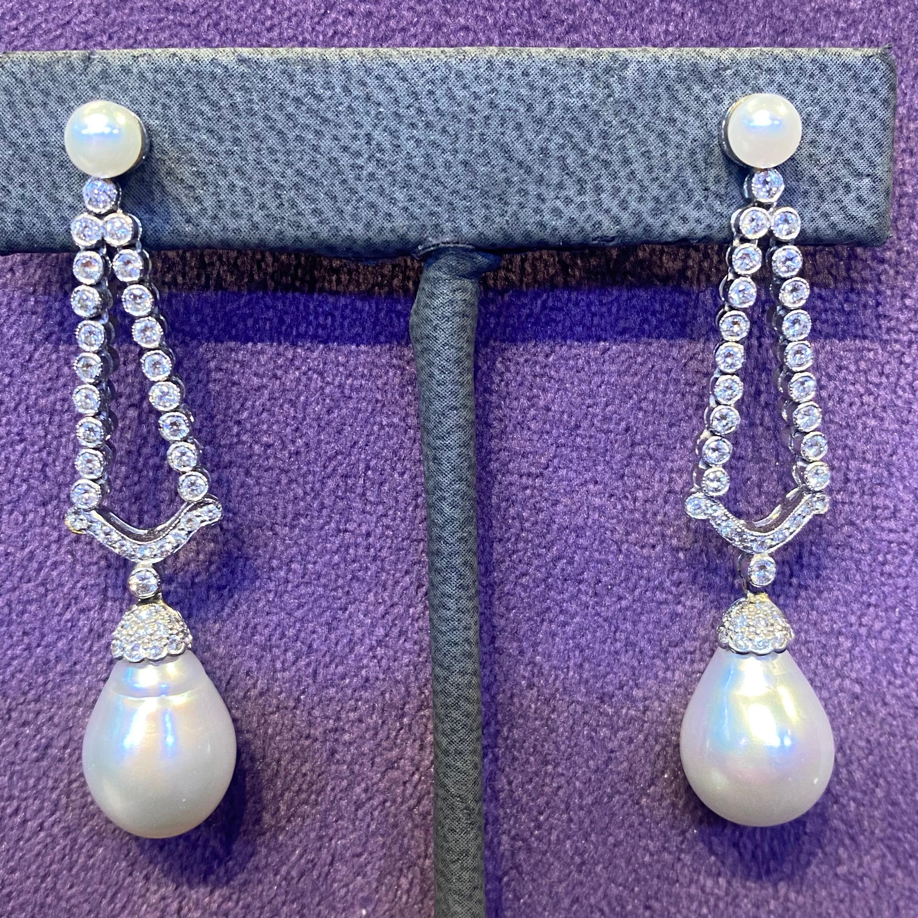 Pearl & Diamond Earrings

Earrings featuring two cultured pearls set with two rows of cascading rounds cut diamonds, with two larger south sea pearls elegantly dangling below.

Large pearl measurements: 13.9x 11.66mm

Diamond Weight: approximately