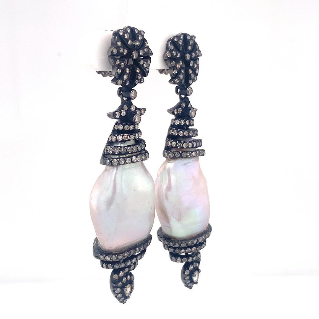 Beautiful pair of natural 51.63-Carat Pearl and 2.45-Carat Diamond Earrings set in Sterling Silver. 