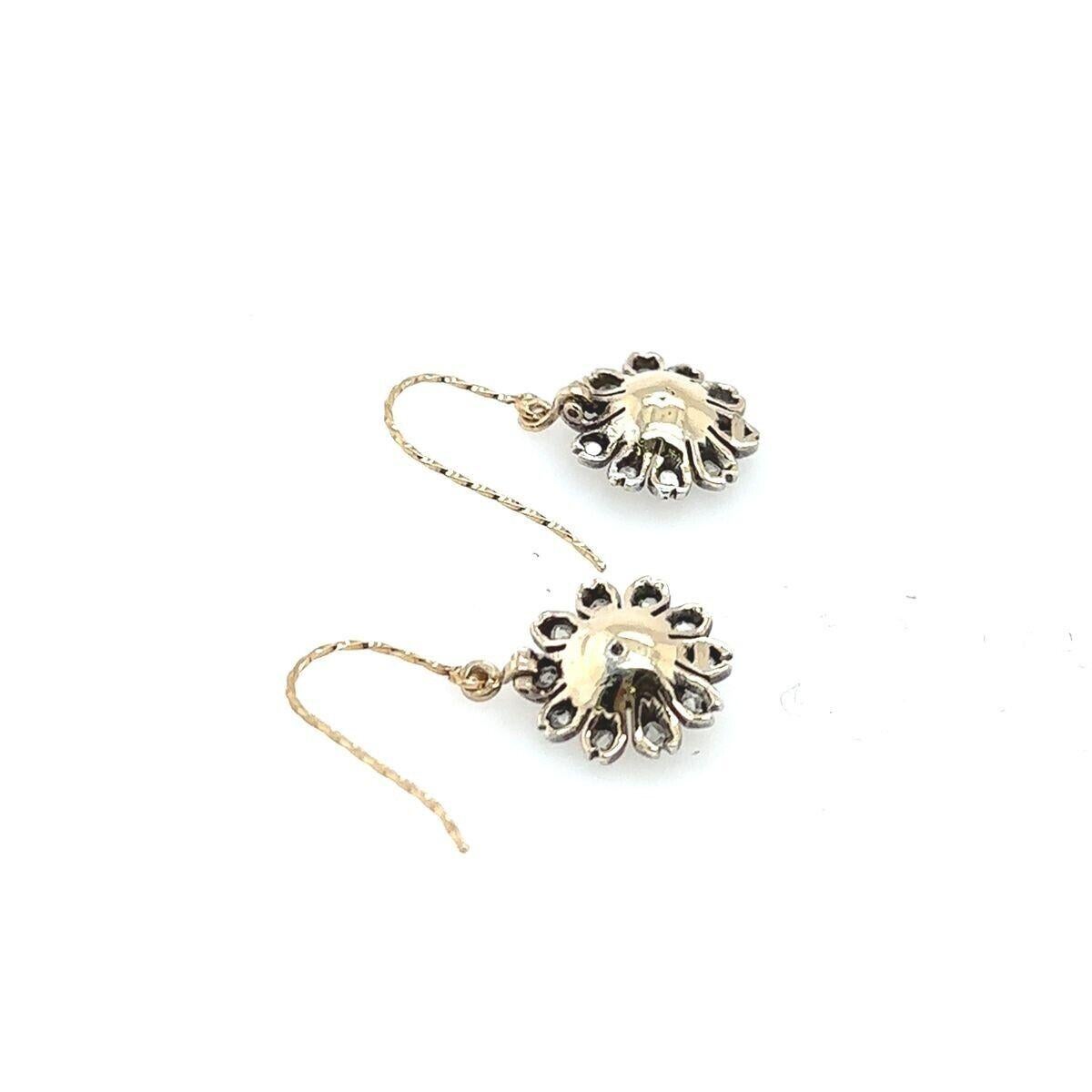 This pair of Diamond pearl flower earrings features a total of 0.20ct of Victorian cut Diamonds set in 9ct Yellow Gold back & silver face. It's perfect for everyday and can be worn with any outfit.

Additional Information:
Total Diamond Weight: