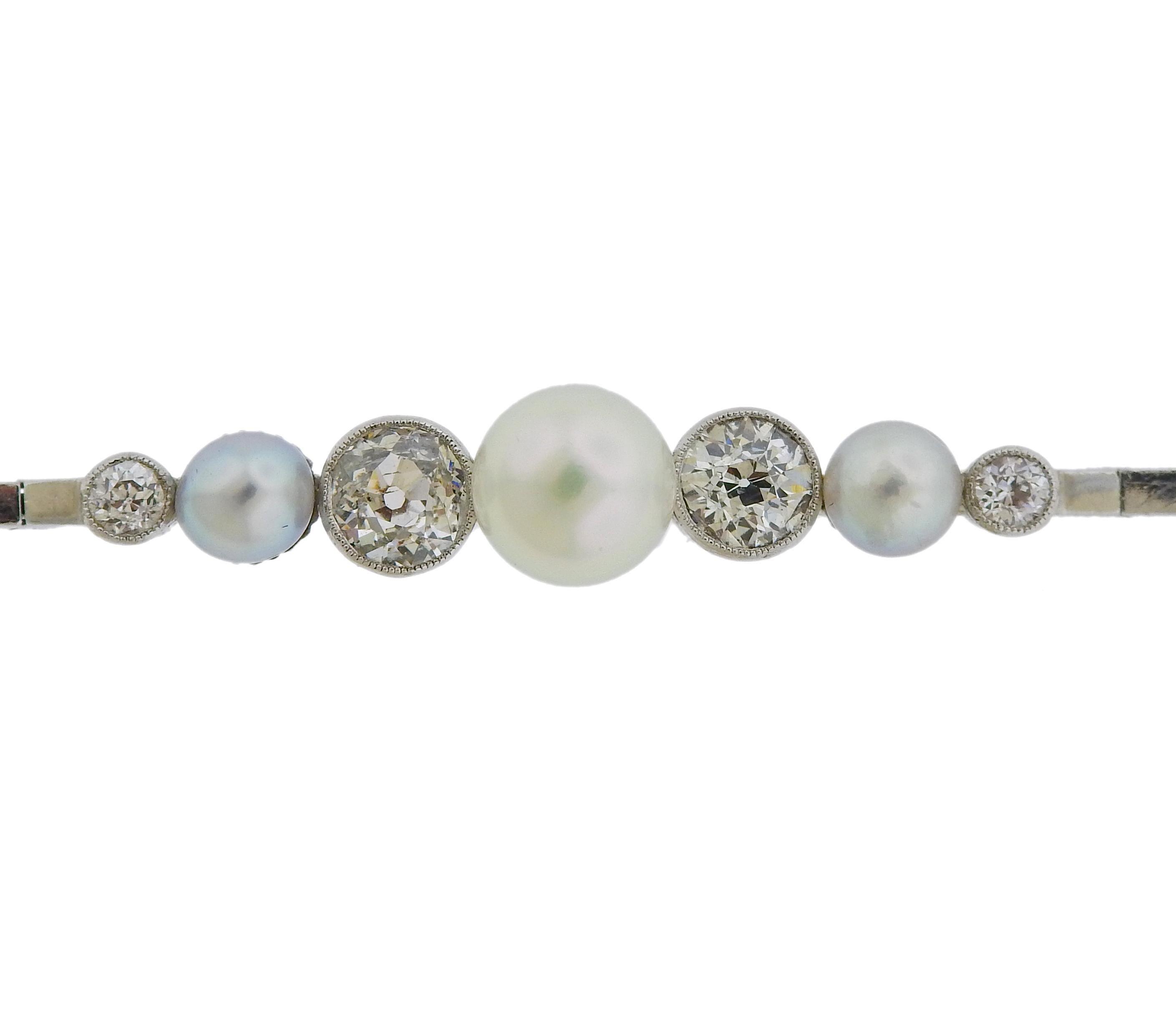 Vintage 14k gold bracelet with 5mm and 7.5mm pearls, surrounded with approx. 1.20ctw in diamonds. Bracelet is 7