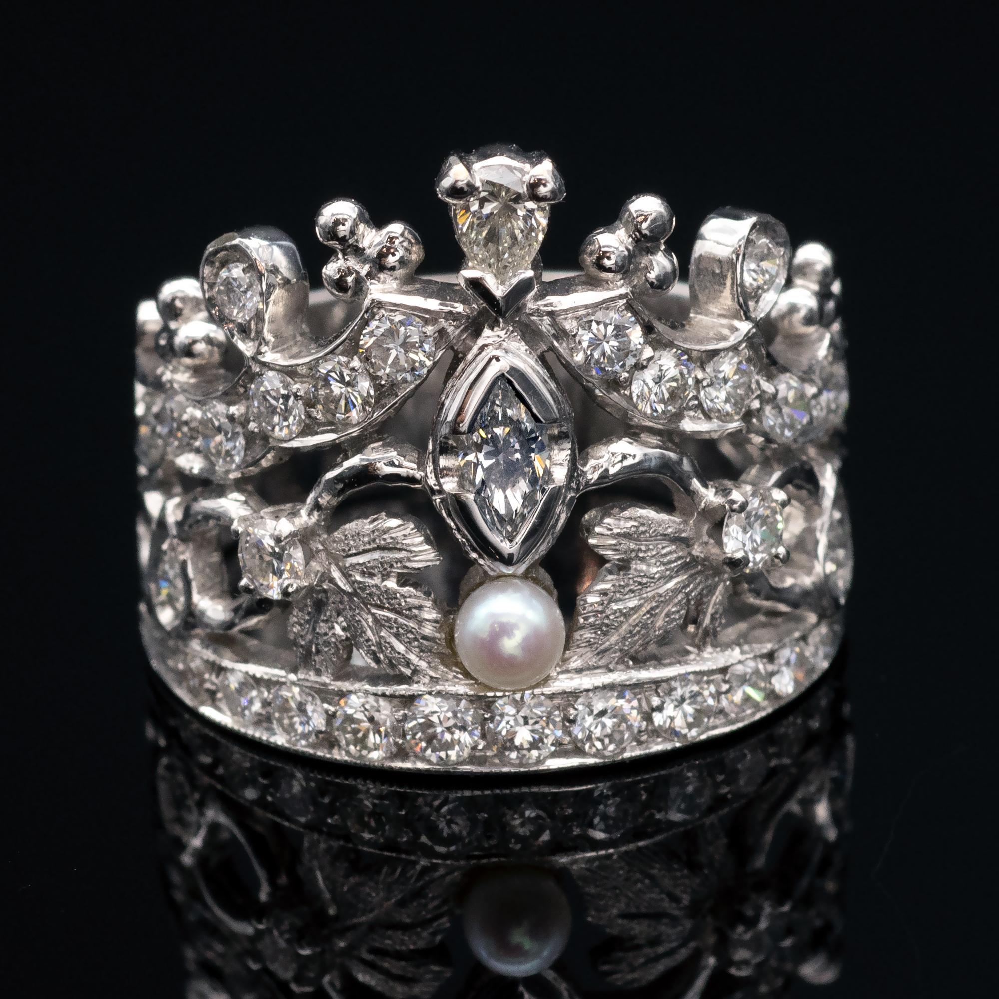 Exquisite crown shape ring.  White Gold and diamonds while two delicately engraved leaves seem to hold a small pearl.

Details:  
Ring Size: 7 ¼ (US), 55 (European). The resizing , is free of charge.
Diamond weight: 1.1 ct, French Hallmark