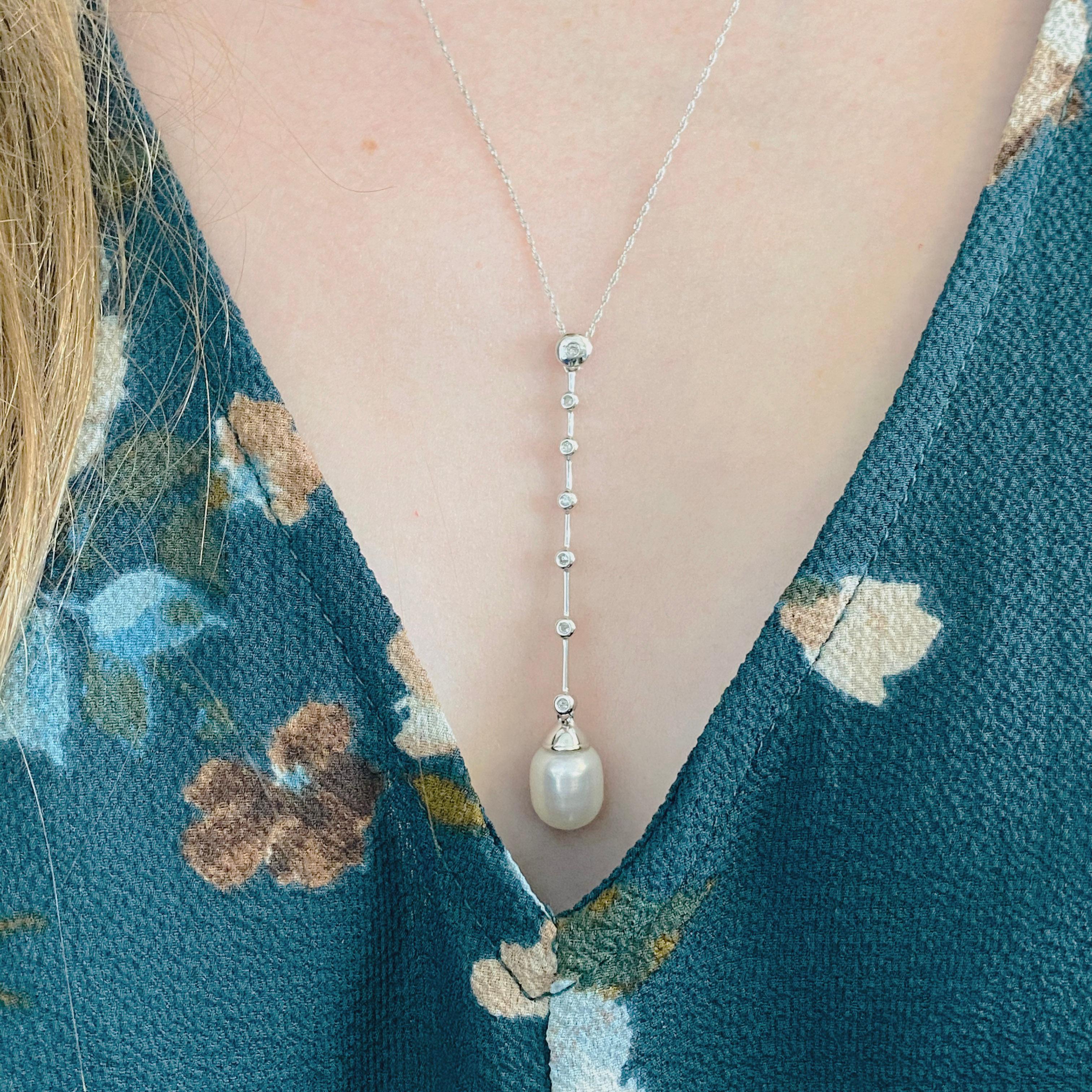This stunningly vintage, beautiful genuine cultured pearl set in polished 14k white gold and dripping with diamonds provides a look that is very modern yet classic! This Circa 1970 necklace is very fashionable and can add a touch of style to any