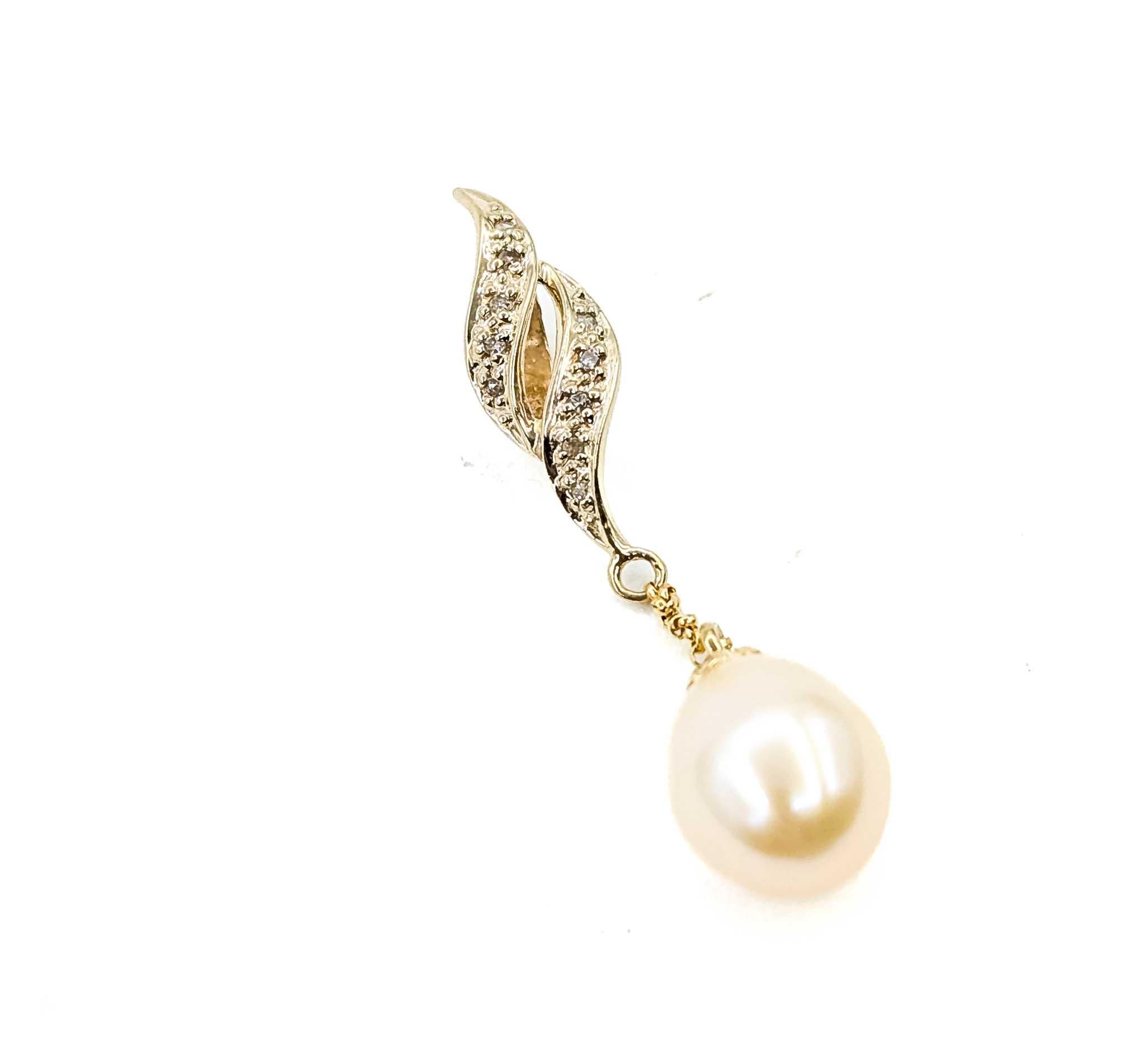 This pendant is crafted in 18k yellow gold and features pearl. The pearl weighs 0.11ct. This pendant is accented by Round Single Cut diamonds.

The pendant measures approximately 41mm by 9.5mm and weighs 2.33 grams. Pearl, the birthstone for June,