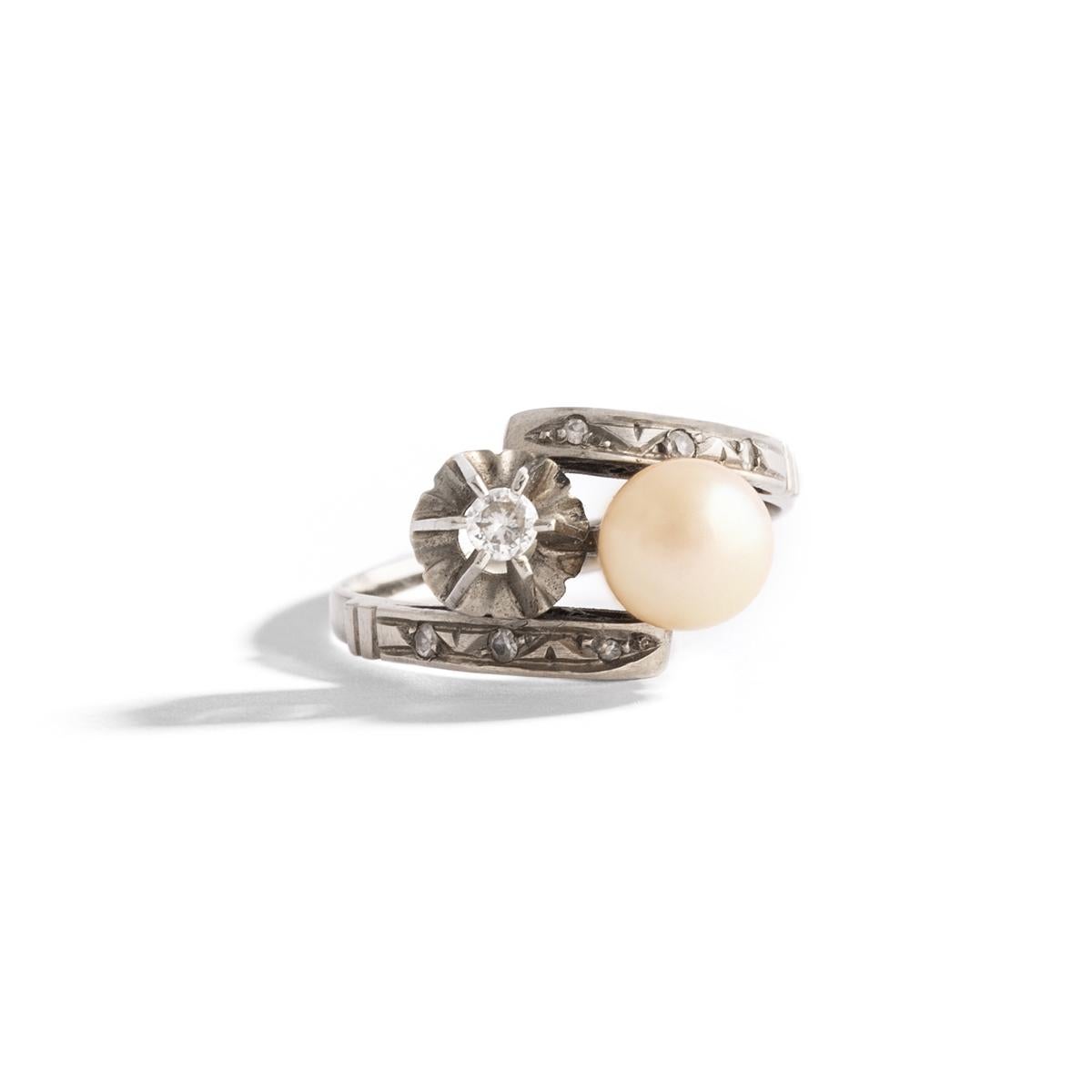 Pearl and Diamond white Gold Ring.
Pearl diameter: approximately 6.57 millimeters.
Diamond estimated weight: 0.16 carat.
Ring Size: 7.