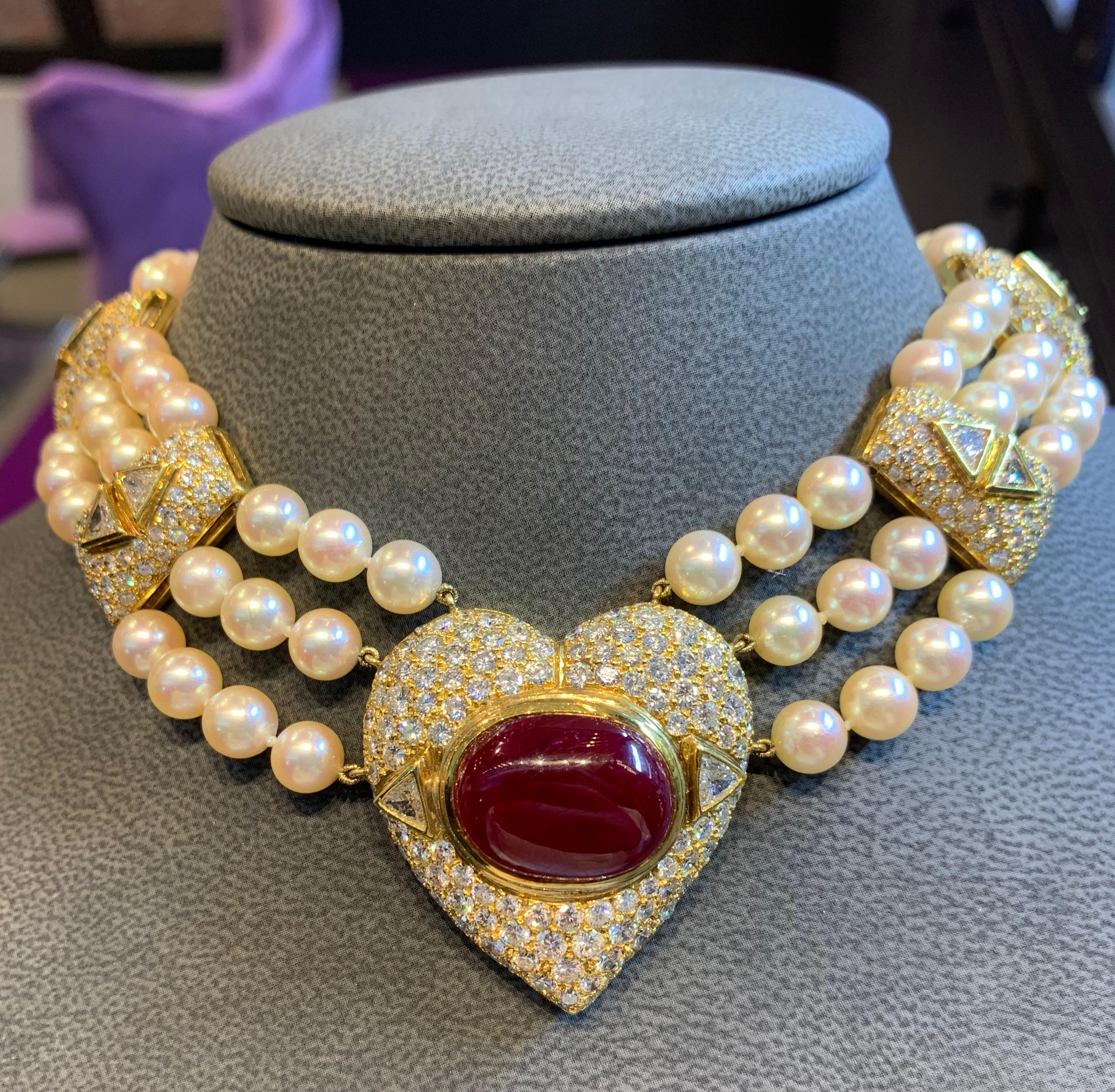 Pearl Diamond & Ruby Multi Strand Heart Necklace, 18K yellow gold
Ruby Weight: 19.40 Cts
Round Diamond Weight: 17.85 Cts
Trillion Diamond Weight: 3.35 Cts
Measurements: 14” long
