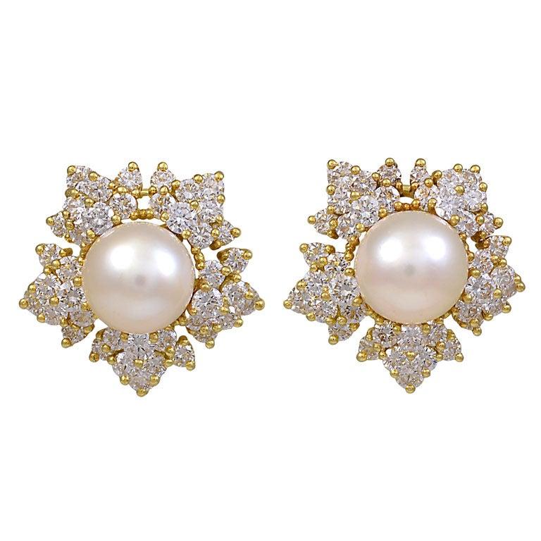 Sparkling pearl and diamond ear clips. These have approximately 3.25cts. of brilliant diamonds, set with a center pearl, 9mm. 18K yellow gold. They are festive, with great presence.

Alice Kwartler has sold the finest antique gold and diamond
