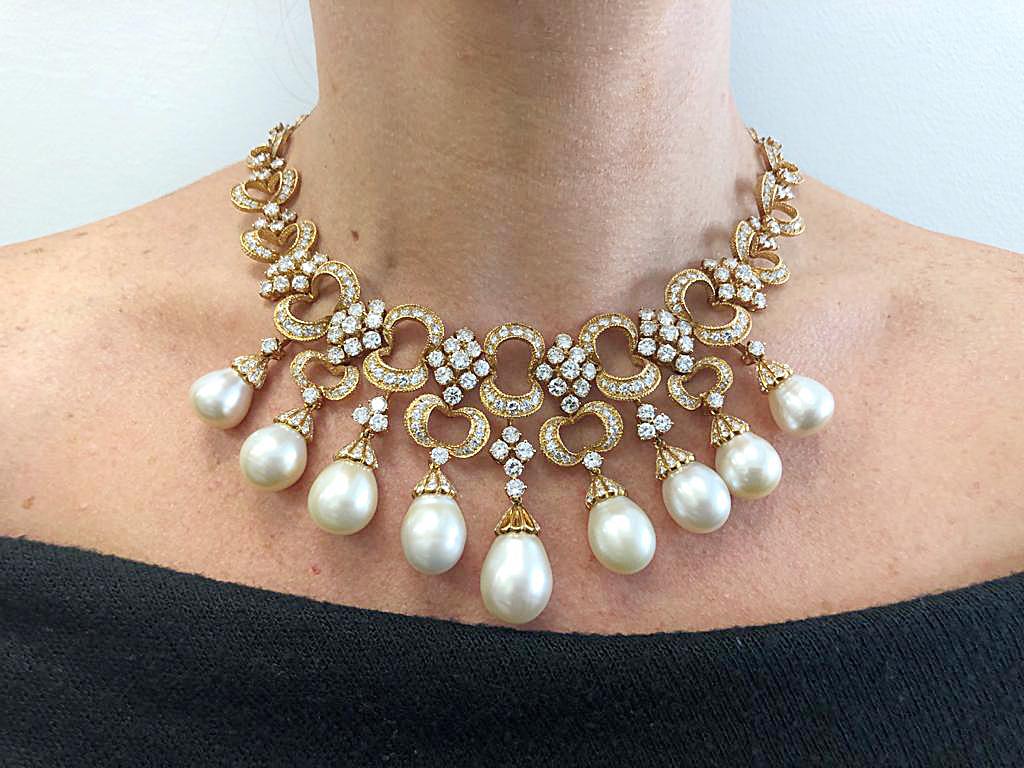 Rocaille-Style Pearl Diamond Fringe Necklace Earrings Suite in 18k Yellow Gold.

A vintage French Rocaille-Style necklace and on-the-ear clips with diamonds suspending South Sea pearls. This demi-parure consists of marquis-shape clusters of diamonds