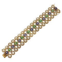 Bracciale con perle, smeraldi, diamanti e zaffiri, 18 carati, con design a cordoncino