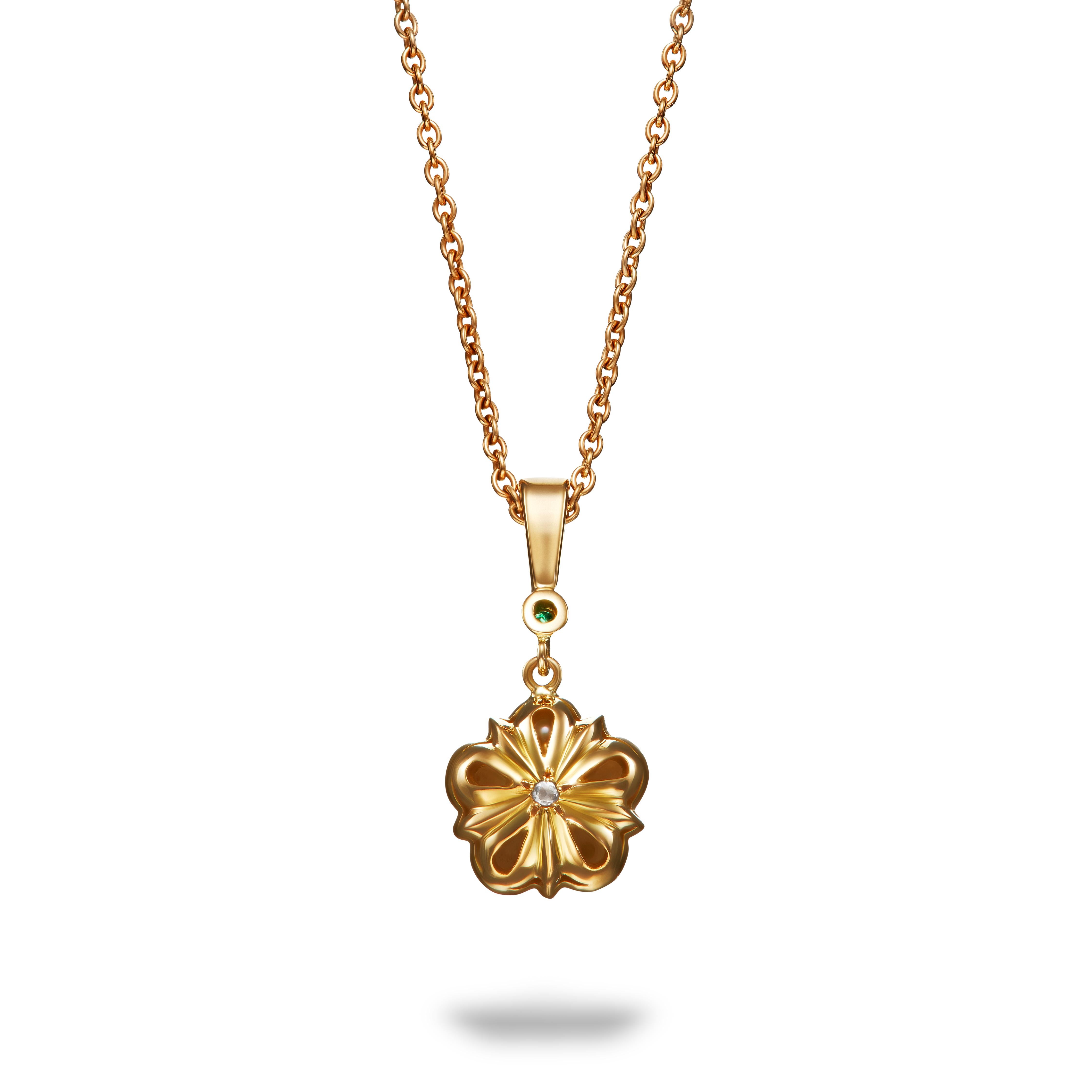 The pearl and emerald Rose pendant features pearls surrounding a round emerald. In true Aril Jewels style, the back of the pendant is just as gorgeous, featuring a tiny rose cut diamond - an extra detail just for the wearer.   

From the Elizabeth