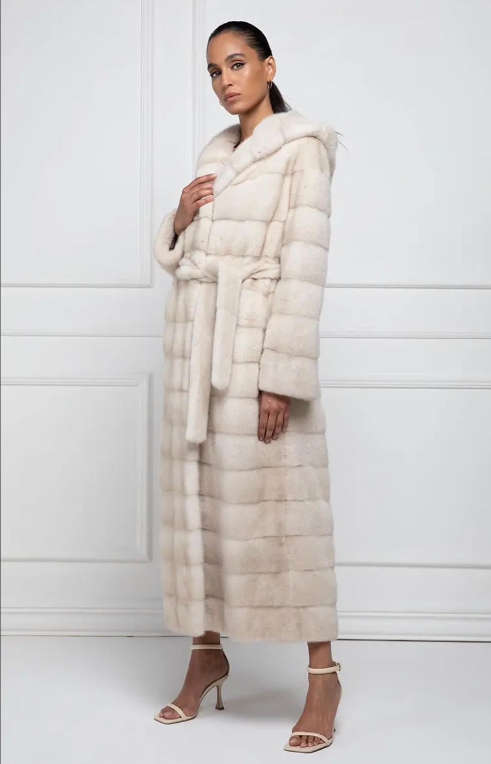 Female Mink Coat
Pearl Mink Coat with full skins. Also this mink coat, as the most part of the collection, is made using female mink carefully selected by our laboratories. The type of mink fur used for this mink coat is Danish, precisely from the