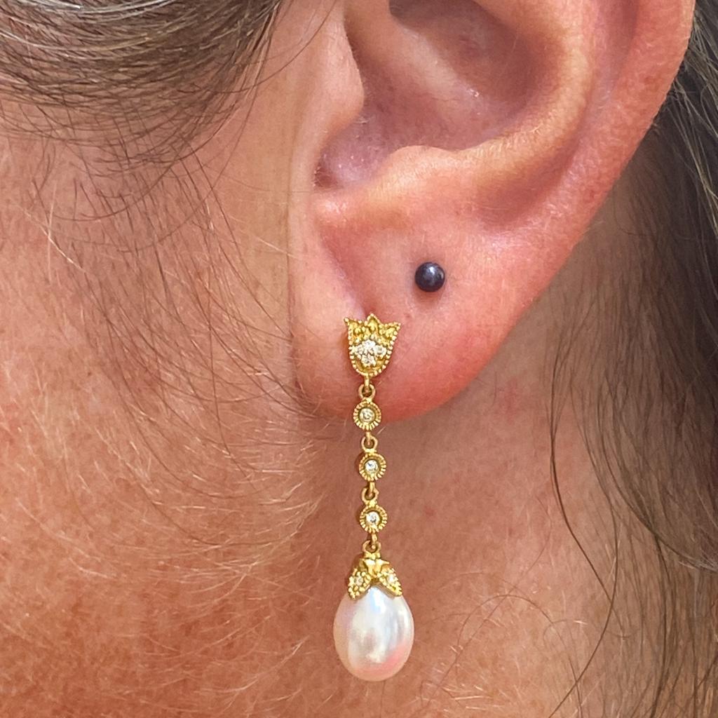 These stunning Gabriel & Co. pearl and diamond earrings are perfect for your wedding day or formal events! The simple elegance of the diamonds and drop pearl is just right for a dressy look! The drops are linked together to sway beautifully as you