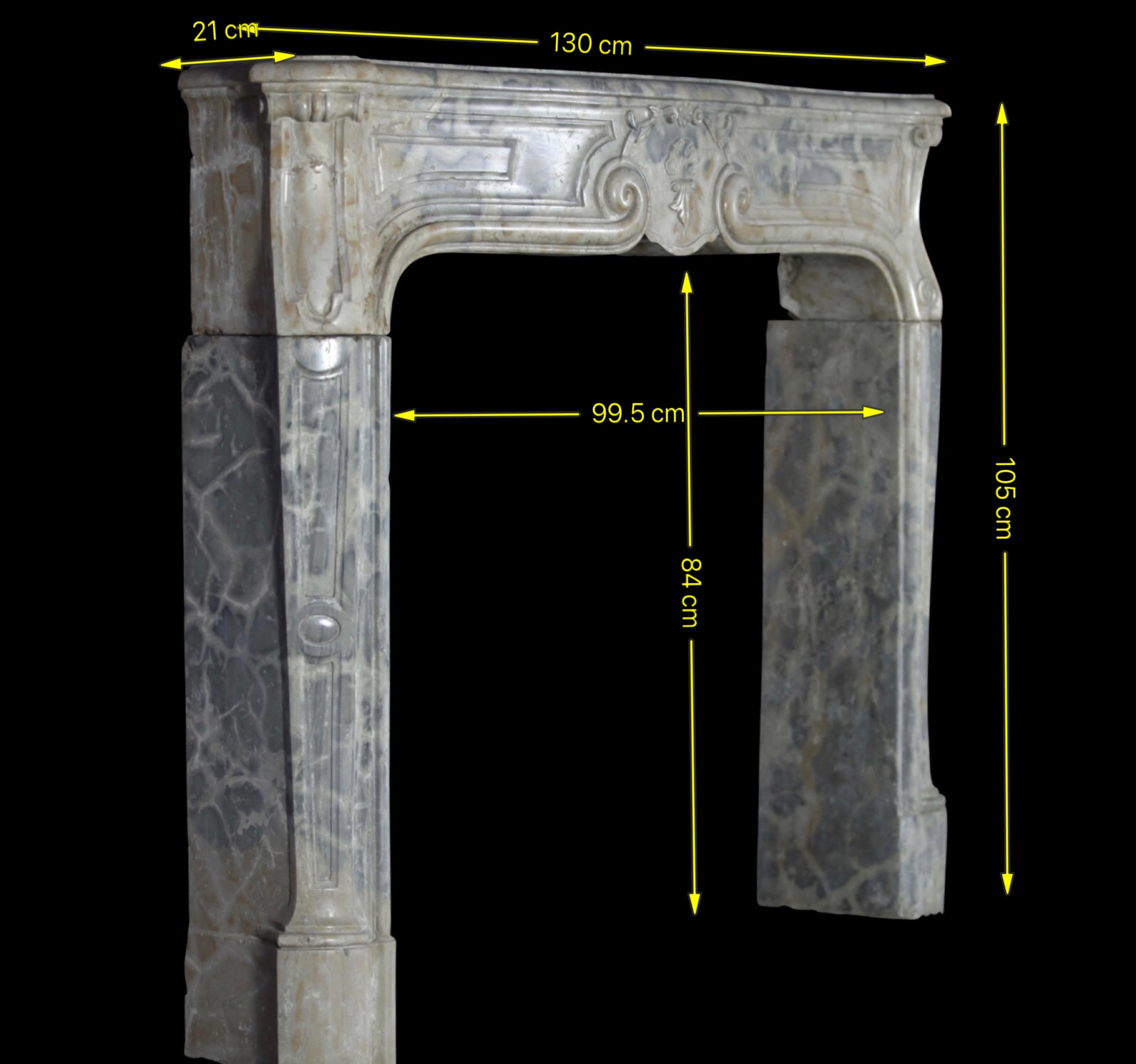 An exceptional original French pearl from the Louis XIV period (18th century): a petite, three-piece (3 solid blocs) antique fireplace surround with rare, room-friendly dimensions—overall 130 cm wide × 105 cm high; opening 99.5 × 84 cm; shelf depth