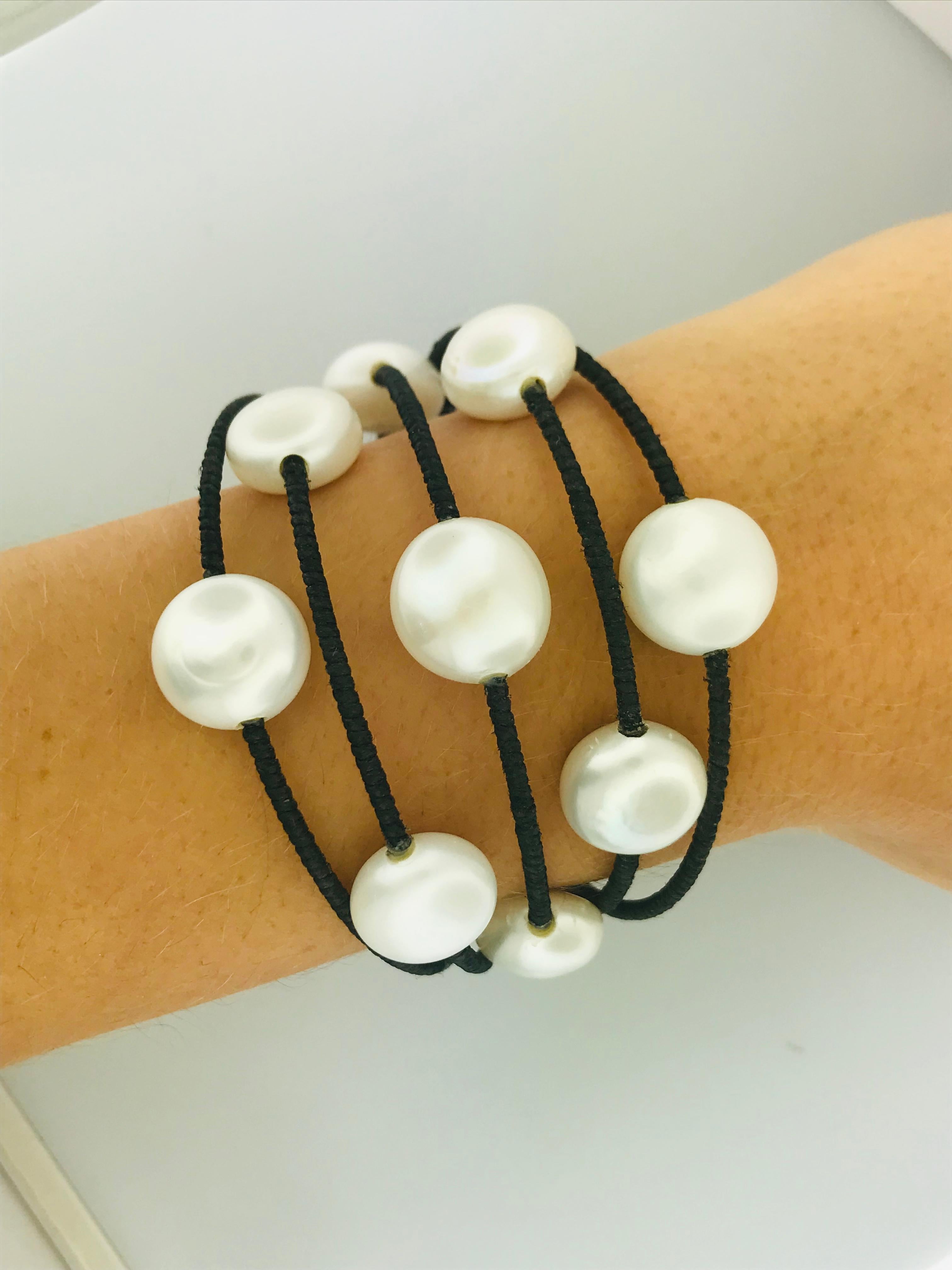 How cute is this modern design with classic materials? Genuine, cultured pearls have been worn forever, the embody class and sophistication. But pearls should be worn for fun too! This fun modern layered pearl station bracelet is a new, one of a