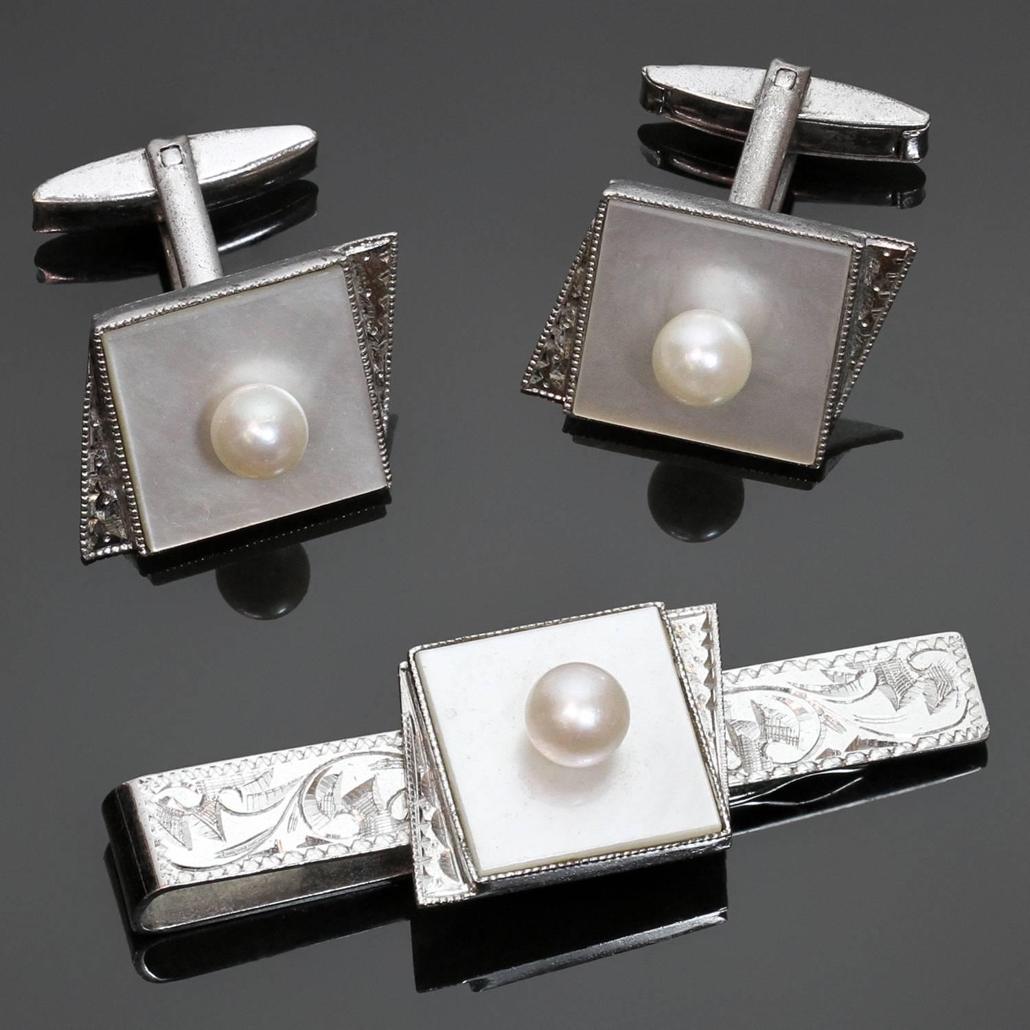 This classic vintage pair of men's cufflinks and a tie clip are beautifully crafted in sterling silver and accented with cultured pearls. Made in United States circa 1960s. Measurements: 0.62