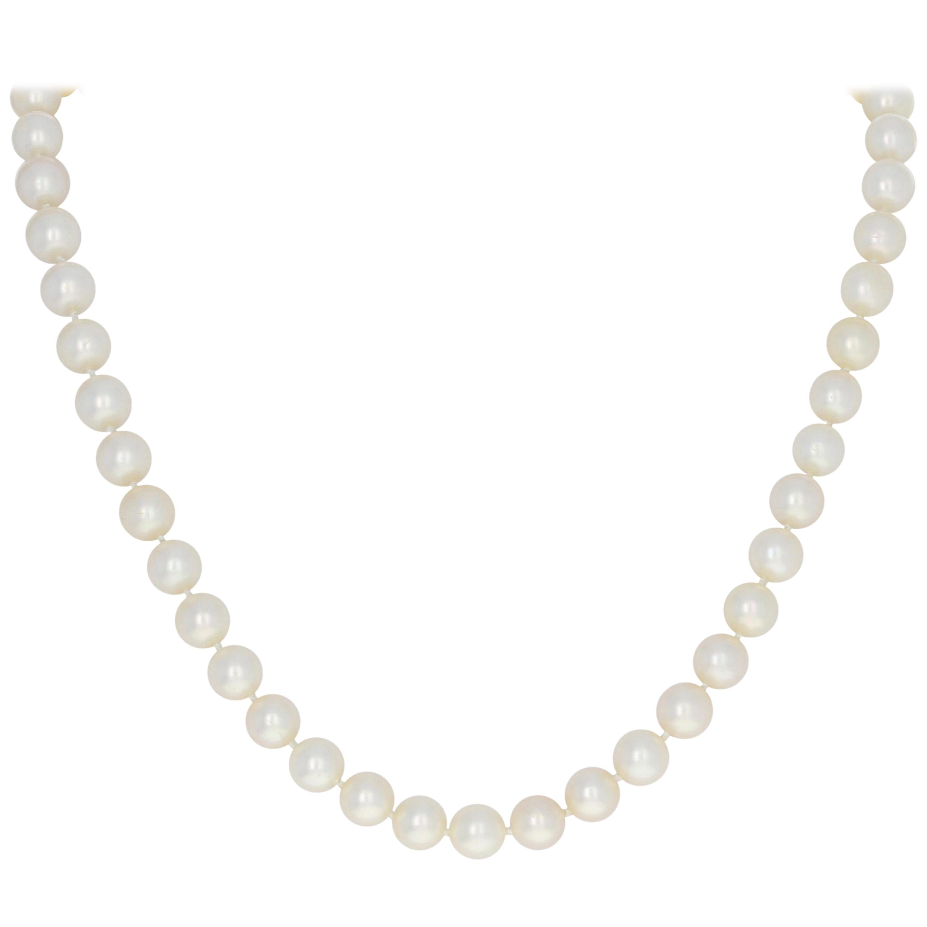 Pearl Necklace, 14 Karat Gold Knotted Strand with Diamond Clasp .75 Carat For Sale