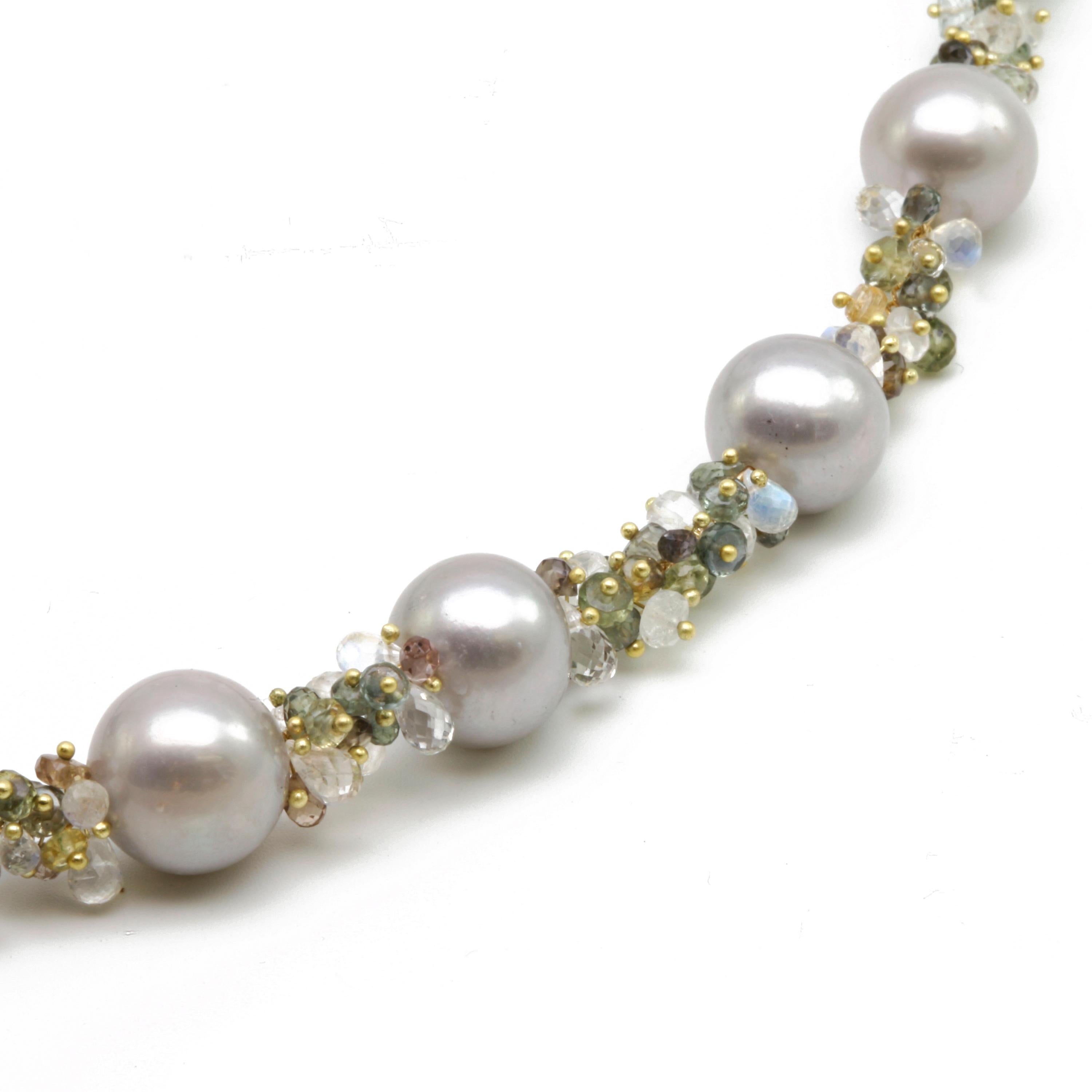    I made this piece with Large Grey Fresh Water Pearls that are placed between clusters of tiny 18k gold finials, Grey Sapphire, Color Change Garnet, micro-faceted Green Amethyst, Citrine, White Topaz, and Moonstone.  It has a signature clasp and a