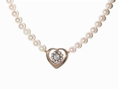 Perlenkette mit Herz-Anhänger:: mit Diamanten besetzt:: 14 Karat Gold