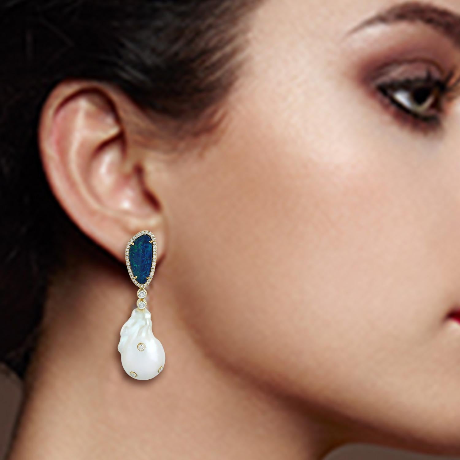 A stunning earrings handmade in 18K gold. It is set in 3.15 carats opal doublet, 63.99 carats pearl, 3.8 carats opal and 1.13 carats diamonds. 

FOLLOW  MEGHNA JEWELS storefront to view the latest collection & exclusive pieces.  Meghna Jewels is
