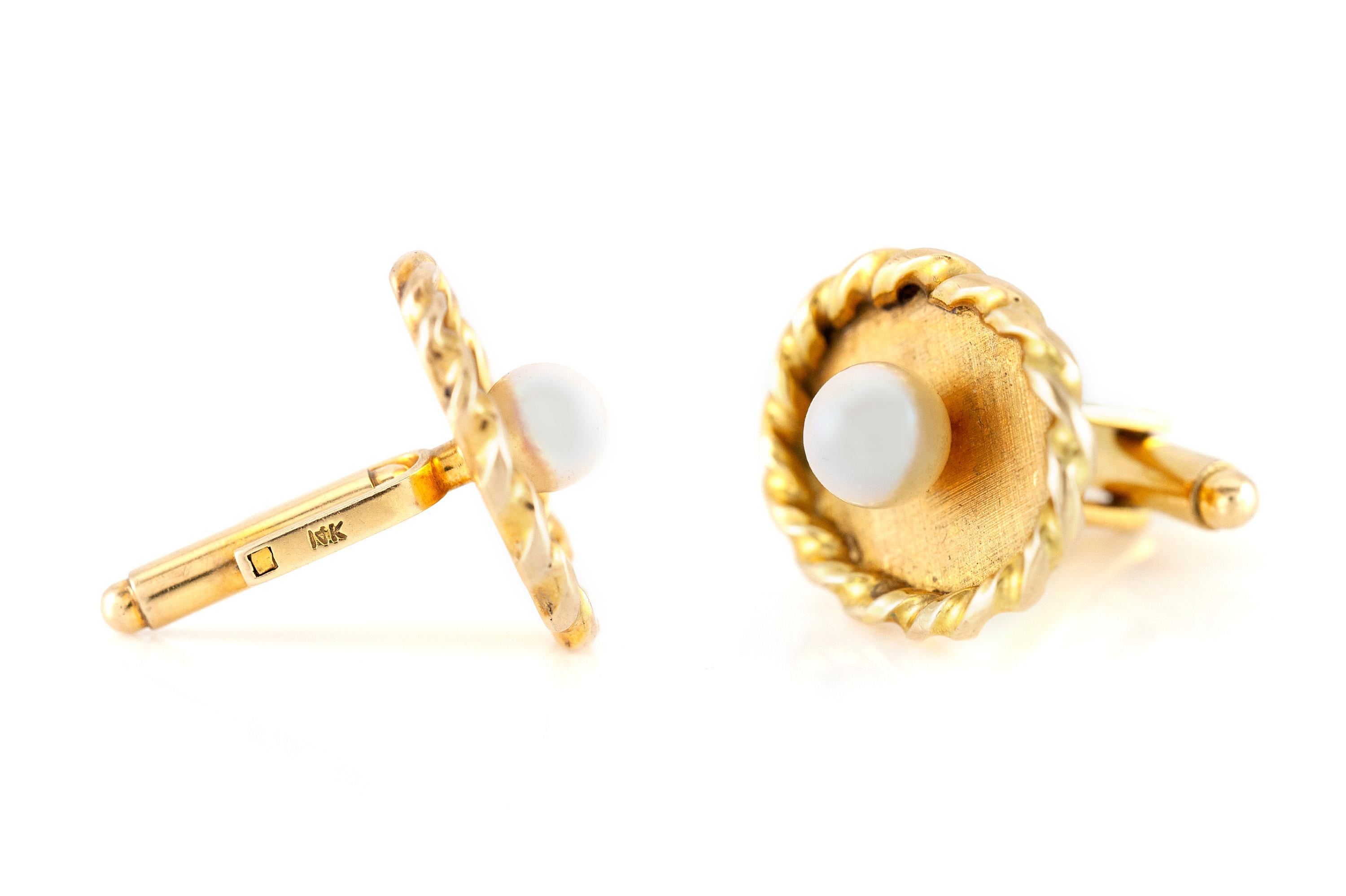 Cufflinks finely crafted in 14k yellow gold with pearls on each piece, size of each cufflink is 1.10 inch. Circa 1970.