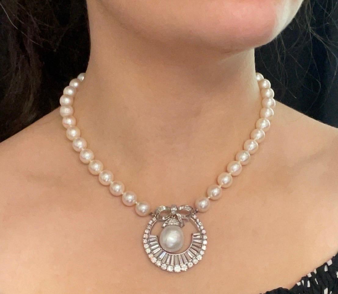 Pearl Pendant Necklace

A South Sea pearl strand necklace featuring a pendant set with marquise, square, triangle, and brilliant cut diamonds with a center dangling pearl. 

Approximate Combined Diamond Weight: 9.4 Carats
Approximate measurement: 