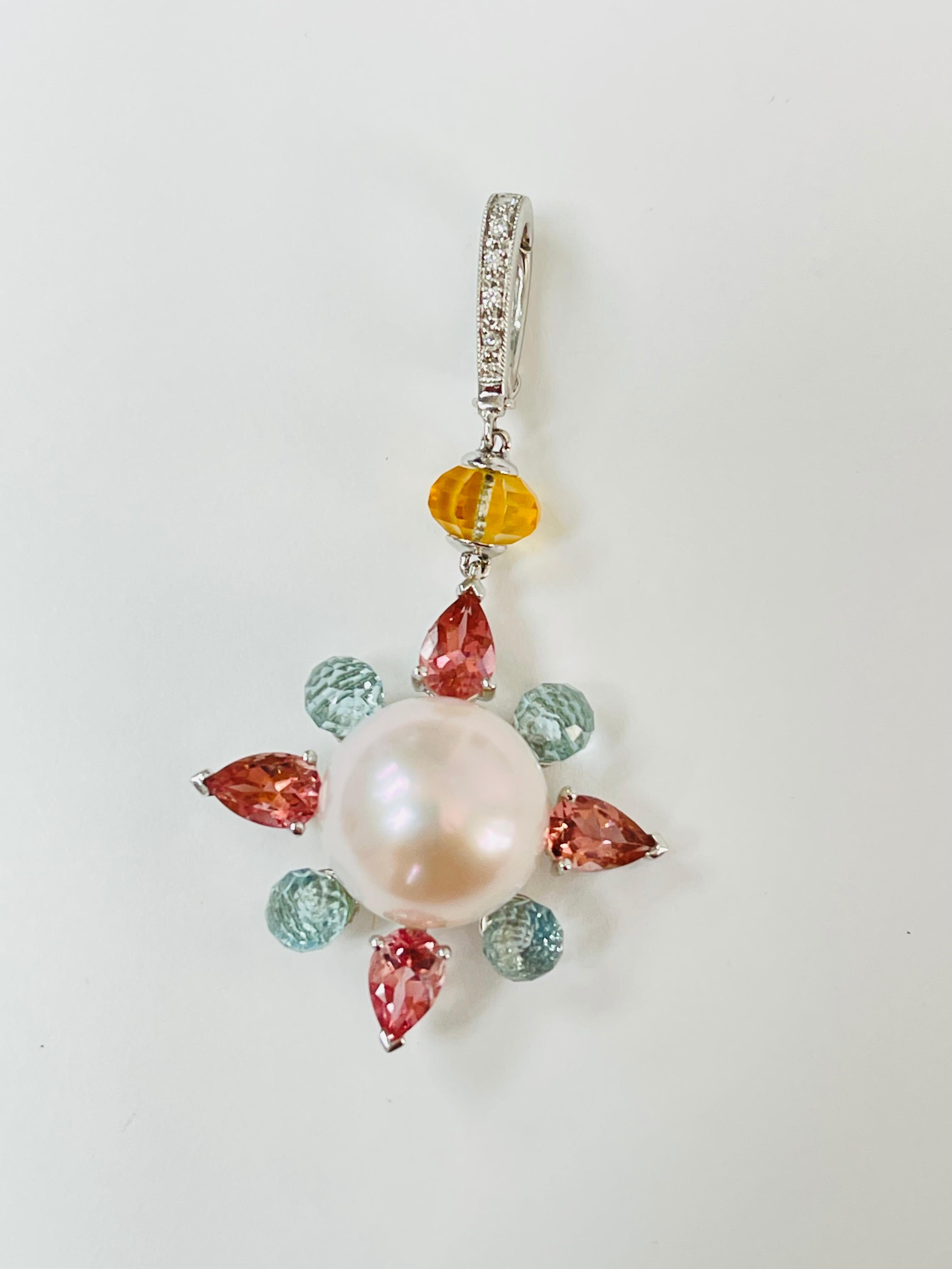 Pearl, pink tourmaline, blue topaz citrine and diamond pendant handcrafted in 14k white gold. 
The details are as follows : 
Pearl : 12.5mm 
Length of the pendant : 2 inches 
Metal : 14k white gold 



