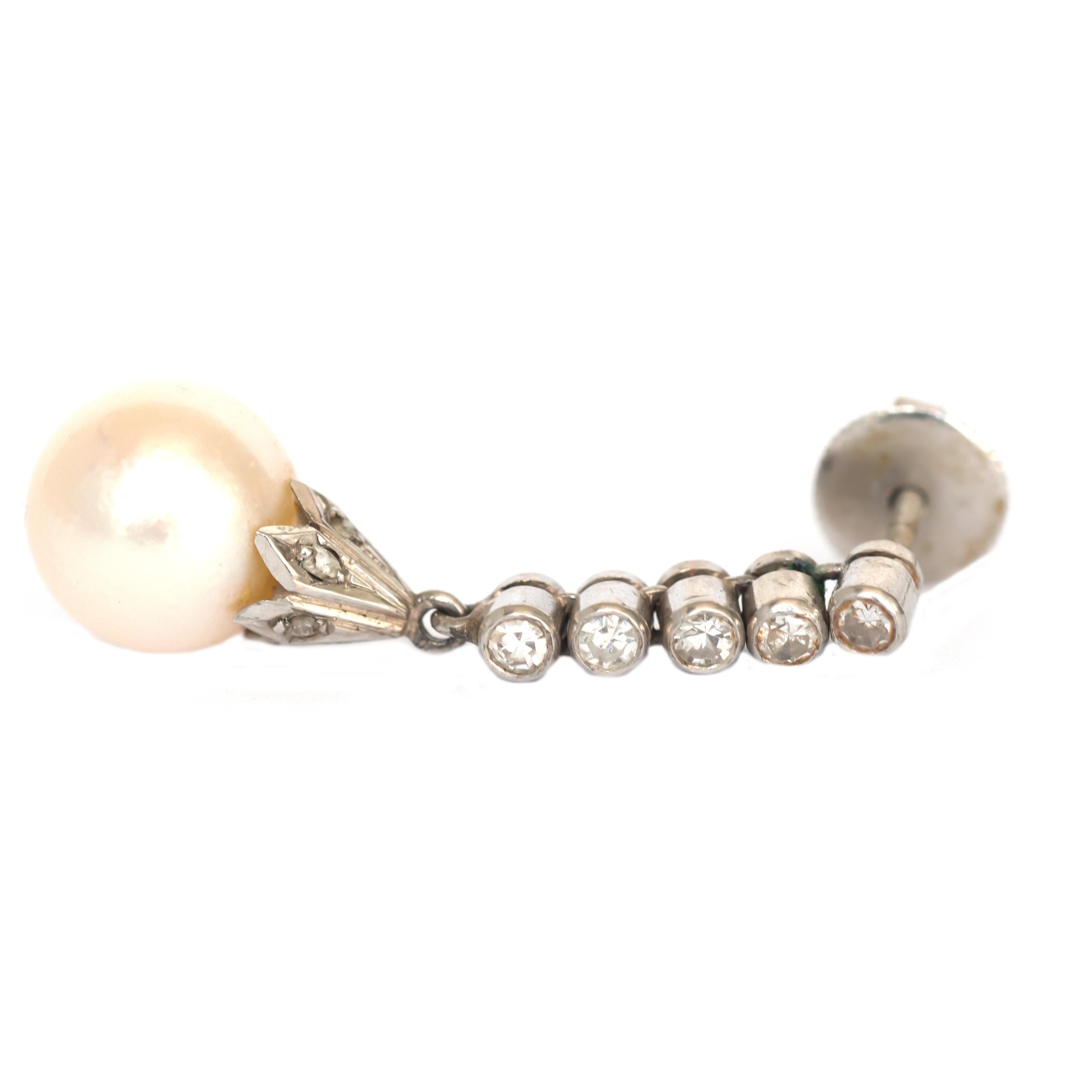Length: 1 inch
Metal Type: Platinum
Weight: 6.6 grams

Center Diamond Details
Type: Natural Pearl
Width: 9.5mm

Side Stone Details: 
Shape: Antique Single Cut 
Total Carat Weight: .20cttw
Color: F
Clarity: VS

Finger to Top of Stone Measurement: