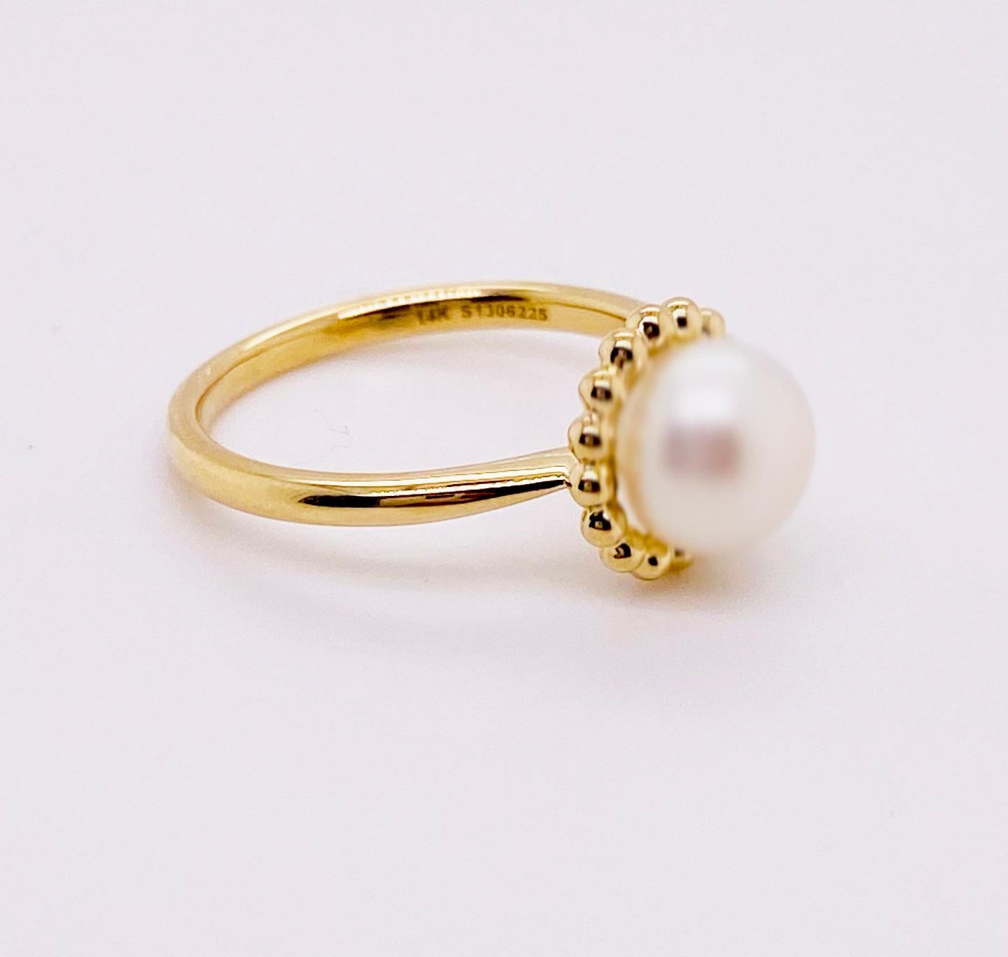 This lovely cultured pearl ring is the perfect gift for a loved one or a great self purchase.  The nice size pearl has a gold beading design that is very simple but elegant.  The pearl is the most desirable color with a nice white color with rose