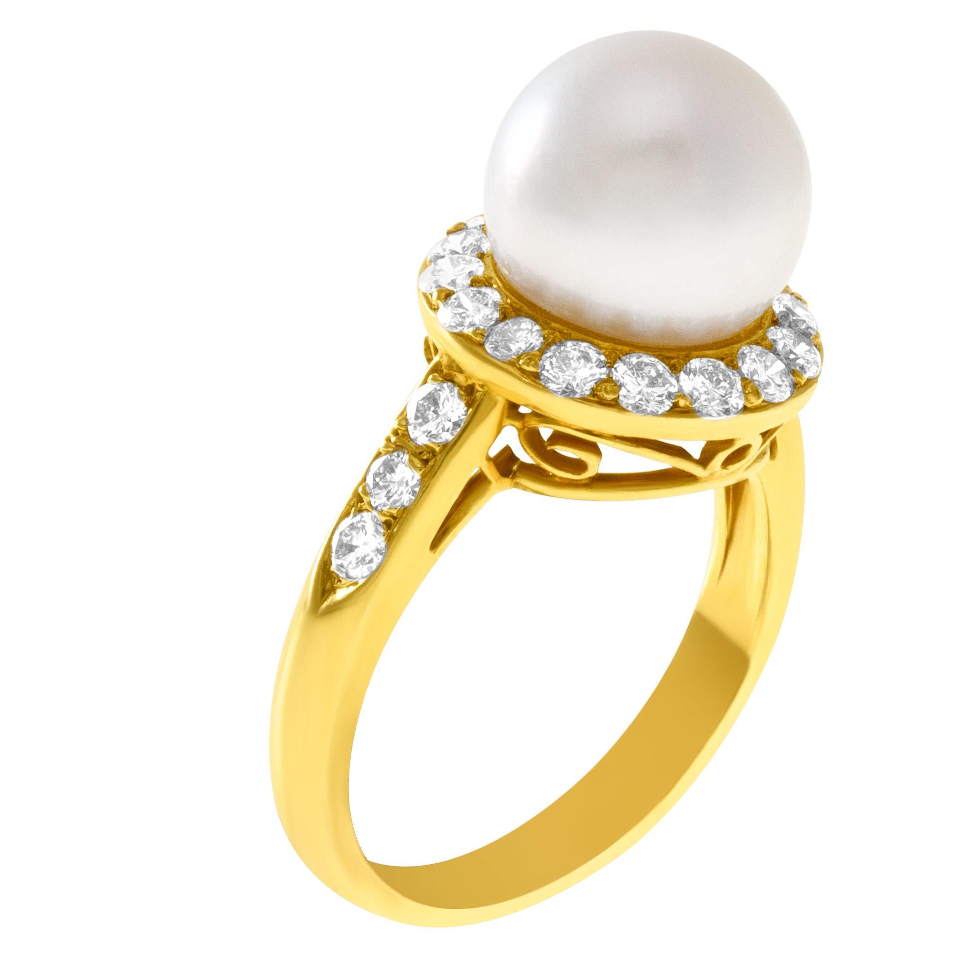 Sweet 9.5 mm pearl ring in 18k with diamond accents approx 1.32 carats. Width at head: 12.3mm, width at shank: 2.4mm. Size 6.  This Diamond/pearl ring is currently size 6 and some items can be sized up or down, please ask! It weighs 4.1 pennyweights