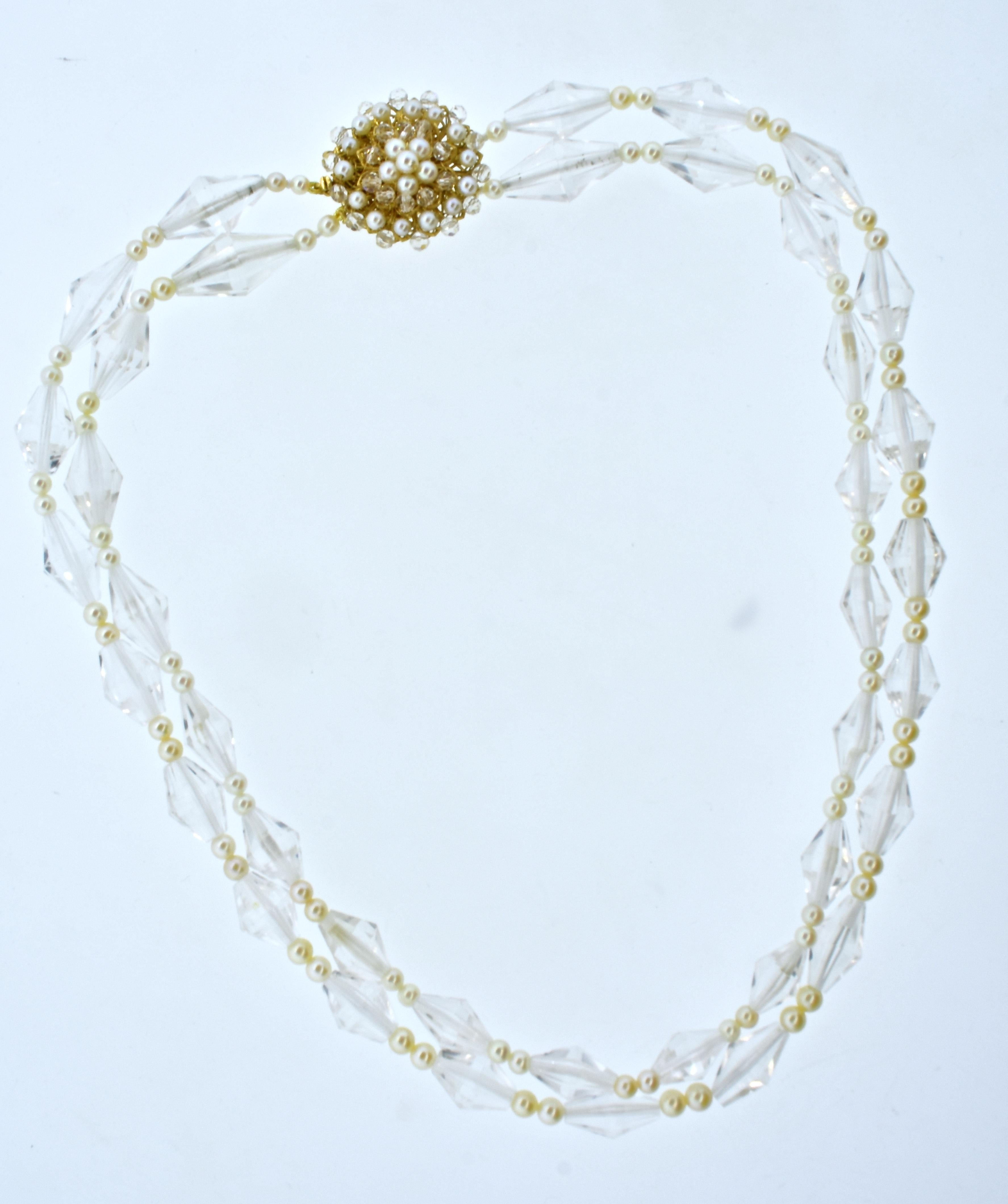 Pearls, fancy cut natural rock crystal and yellow gold come together to create this feminine necklace and earring set.  The necklace is 18.5 inches long.  The 39 white faceted natural rock crystal are all well matched and with a fancy facet design