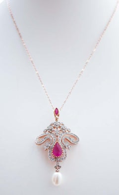 Pearl, Rubies, Diamonds, Rose Gold and Silver Pendant Necklace.