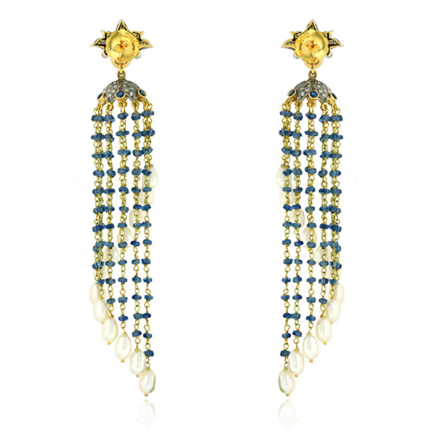 These tassel earrings are handmade in 14-karat gold & sterling silver. It is set in 21.5 carats pearl, 24.23 carats sapphire and .73 carats of diamonds. 

FOLLOW  MEGHNA JEWELS storefront to view the latest collection & exclusive pieces.  Meghna